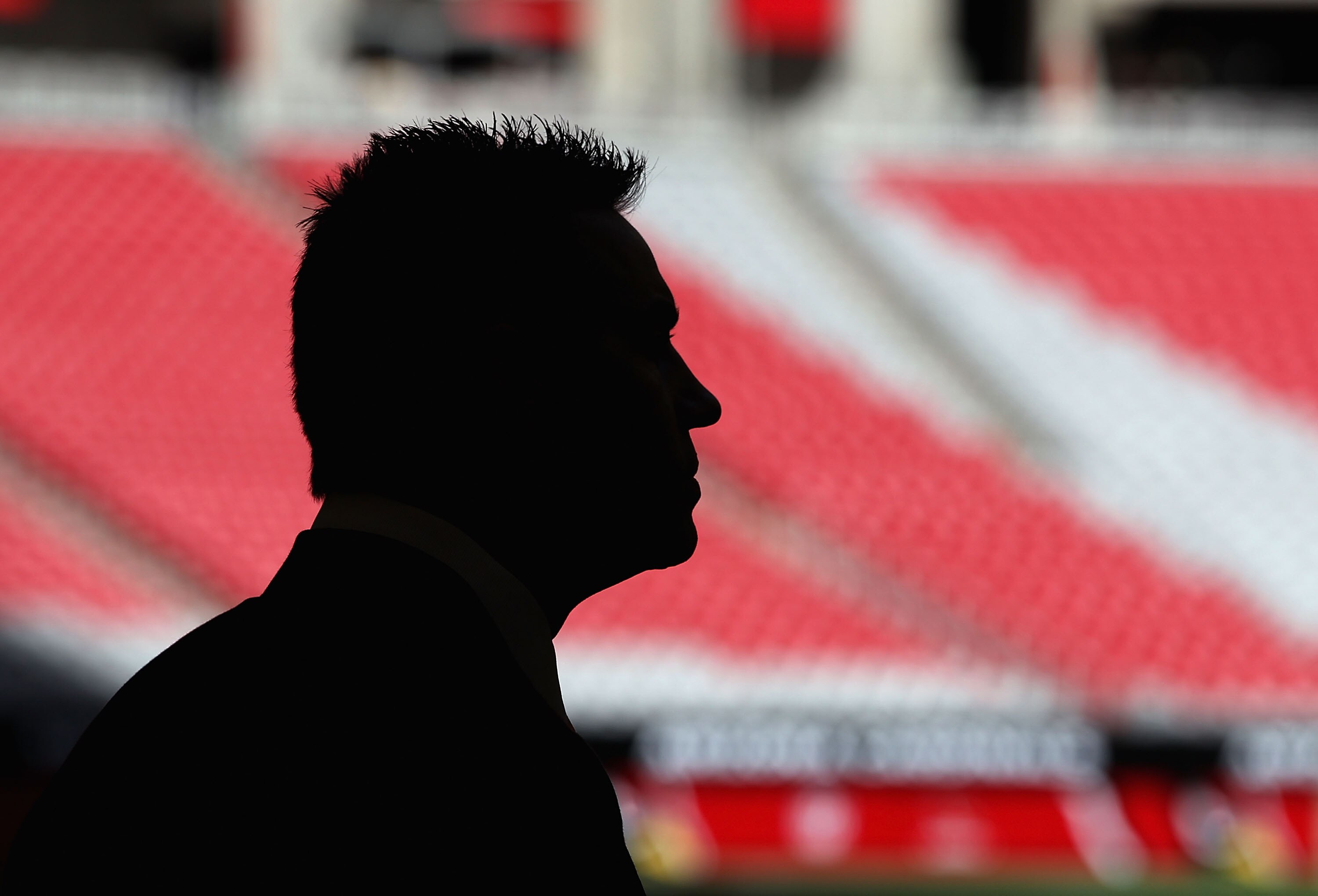 GLENDALE, AZ - DECEMBER 05:  Former NFL quarterback Kurt Warner stands on the field before the NFL game between the St. Louis Rams and the Arizona Cardinals at the University of Phoenix Stadium on December 5, 2010 in Glendale, Arizona.  (Photo by Christia