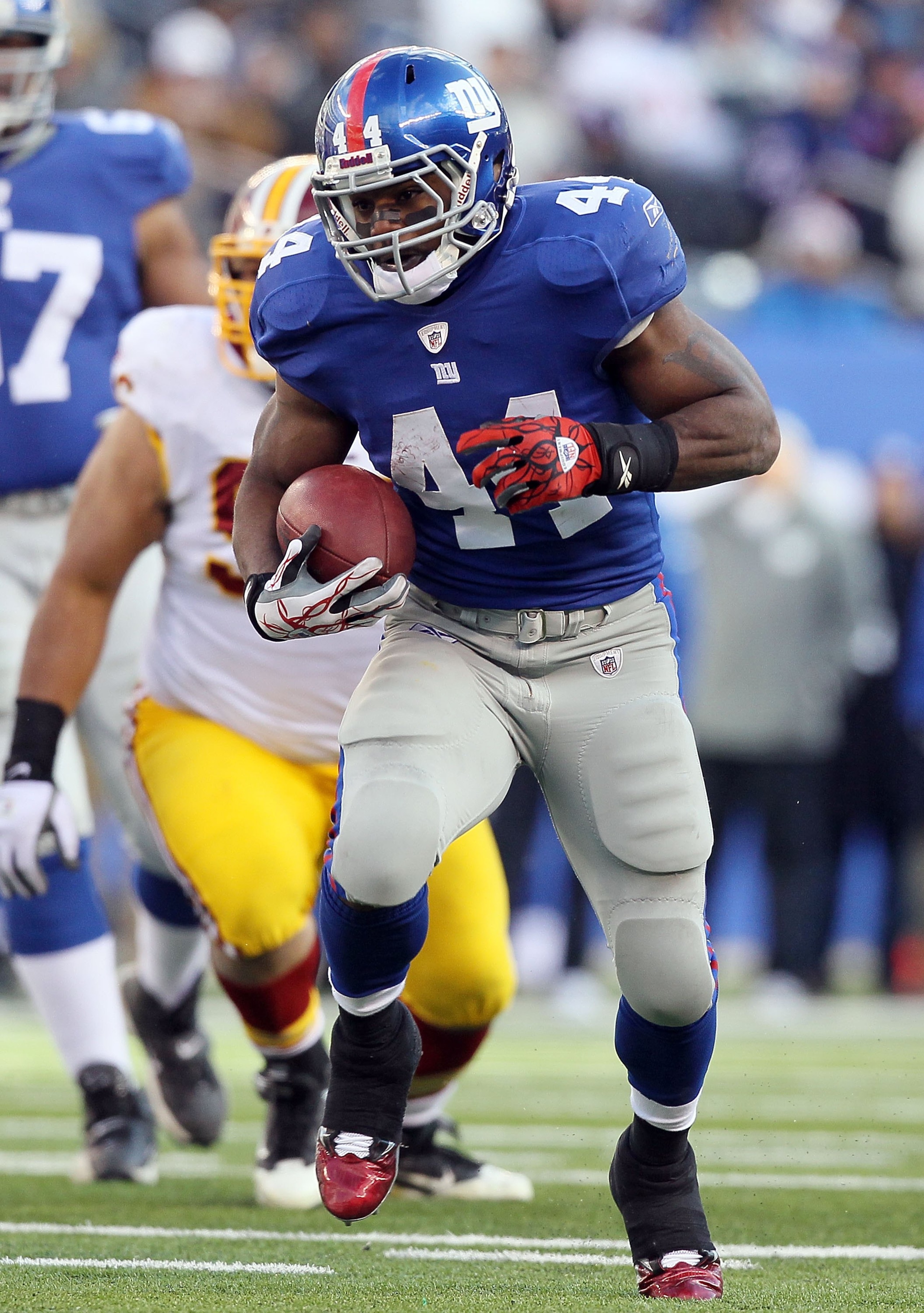 EAST RUTHERFORD, NJ - DECEMBER 05:  Ahmad Bradshaw #44 of the New York Giants runs the ball against the Washington Redskins on December 5, 2010 at the New Meadowlands Stadium in East Rutherford, New Jersey. The Giants defeated the Redskins 31-7.  (Photo b