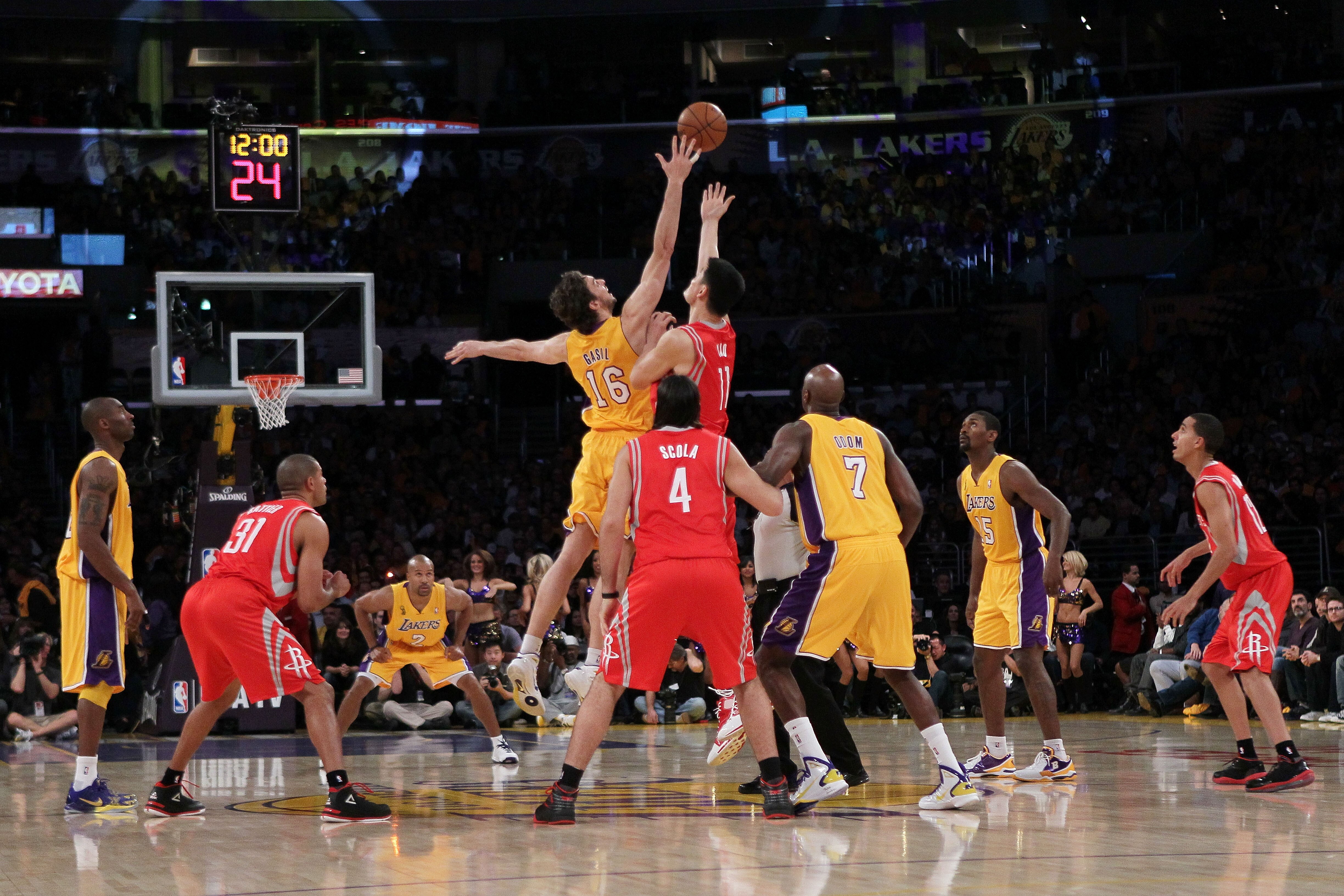 LOS ANGELES, CA - OCTOBER 26:  Pau Gasol #16 of the Los Angeles Lakers and Yao Ming #11 of the Houston Rockets jump for the opening tip-off during their NBA game at Staples Center on October 26, 2010 in Los Angeles, California. NOTE TO USER: User expressl