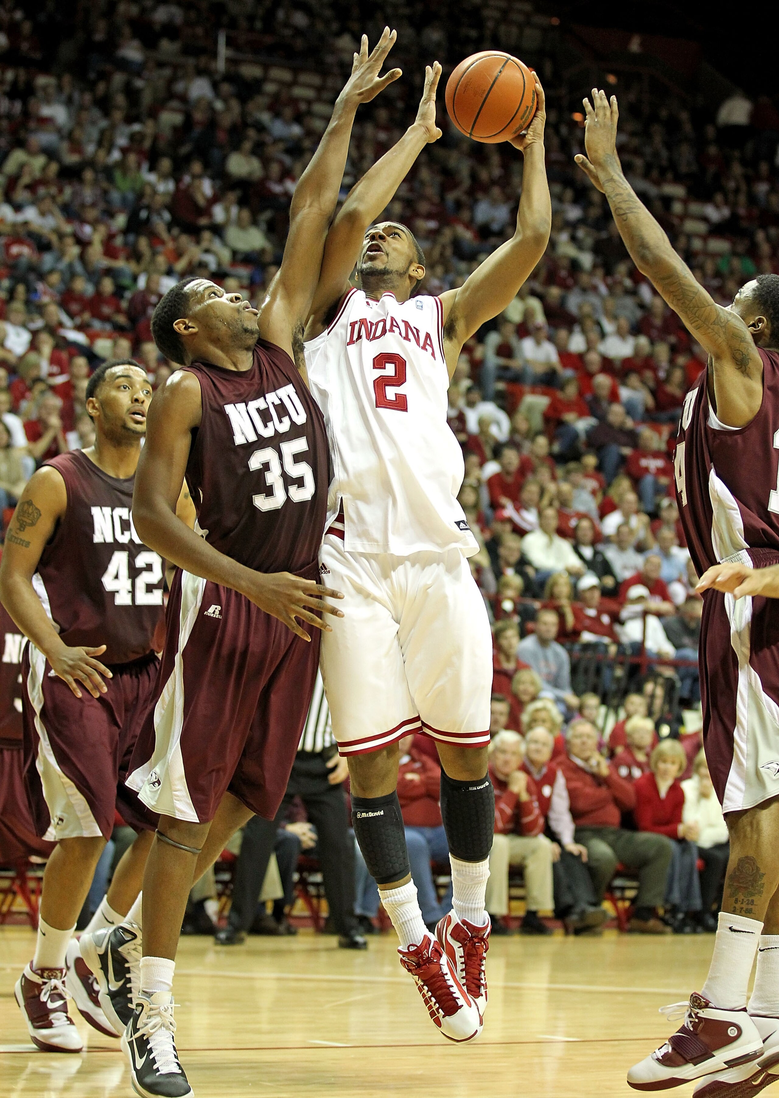 BLOOMINGTON, IN - NOVEMBER 23:  Christian Watford #2 of the Indiana Hoosiers shoots the ball while defended by Samuel Chasten #35 of the North Carolina Central Eagles at Assembly Hall on November 23, 2010 in Bloomington, Indiana.  Indiana won 72-56.  (Pho