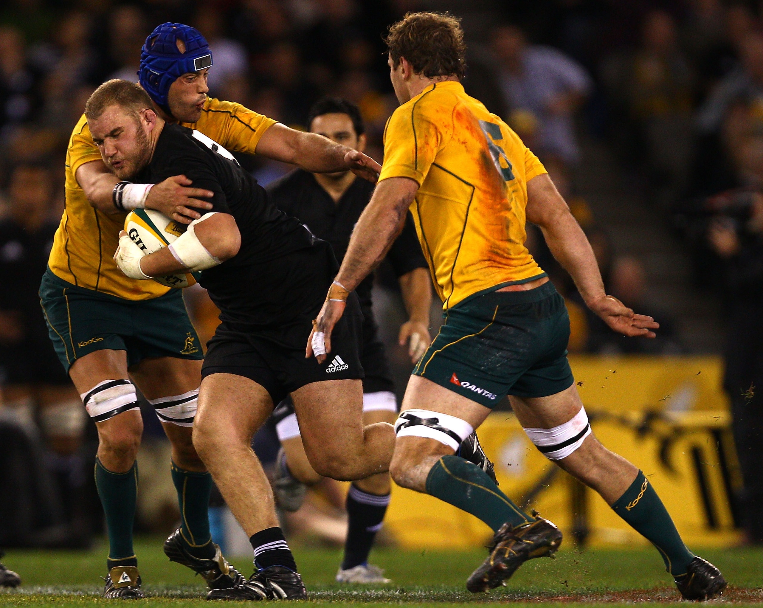 MELBOURNE, AUSTRALIA - JULY 31:  Owen Franks of the All Blacks is tackled during the 2010 Tri-Nations Bledisloe Cup match between the Australian Wallabies and the New Zealand All Blacks on July 31, 2010 in Melbourne, Australia.  (Photo by Mark Dadswell/Ge