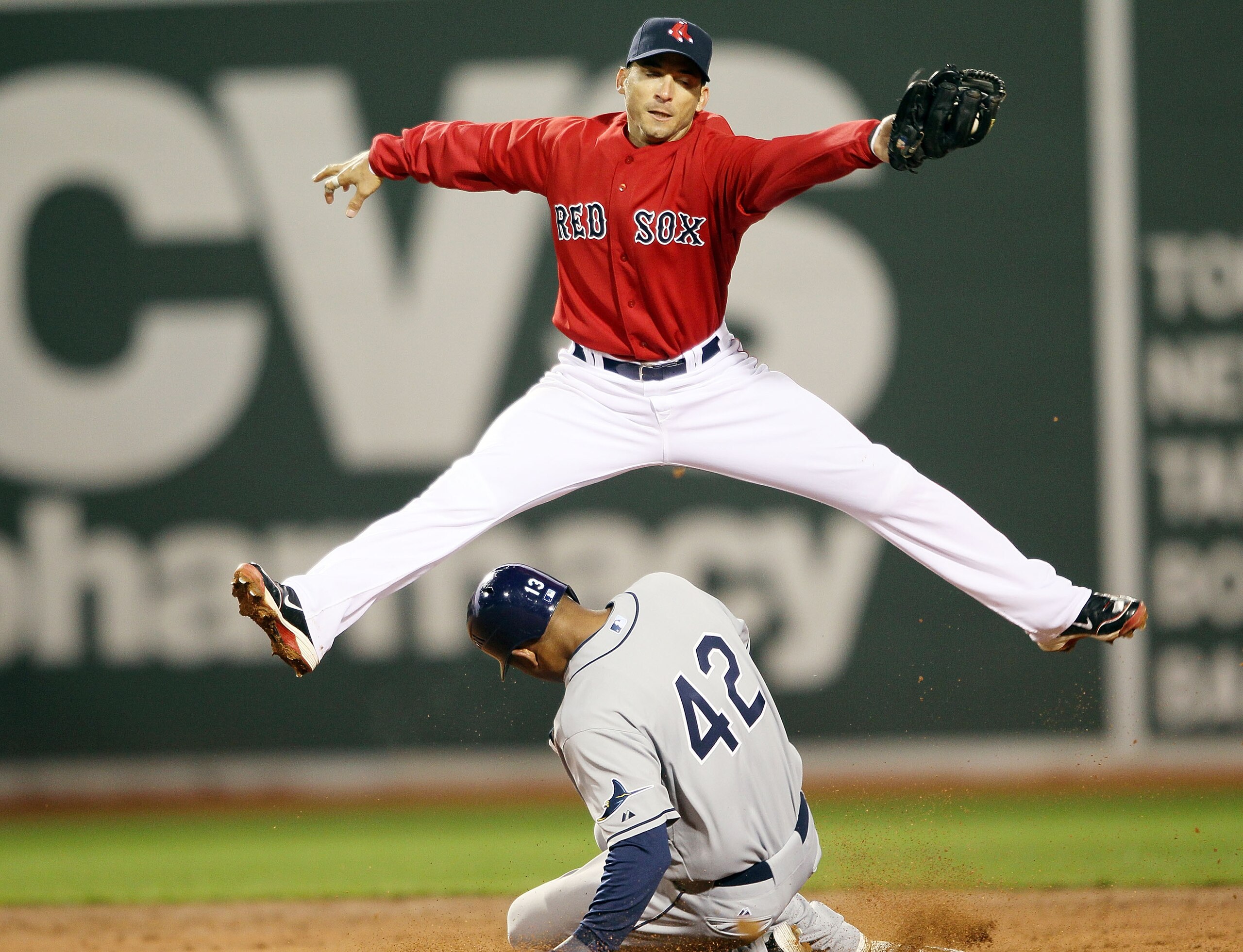 BOSTON - APRIL 16:  Marco Scutaro #16 of the Boston Red Sox makes the catch but Carl Crawford #13 of the Tampa Bay Rays is safe at second on April 16, 2010 at Fenway Park in Boston, Massachusetts.  (Photo by Elsa/Getty Images)