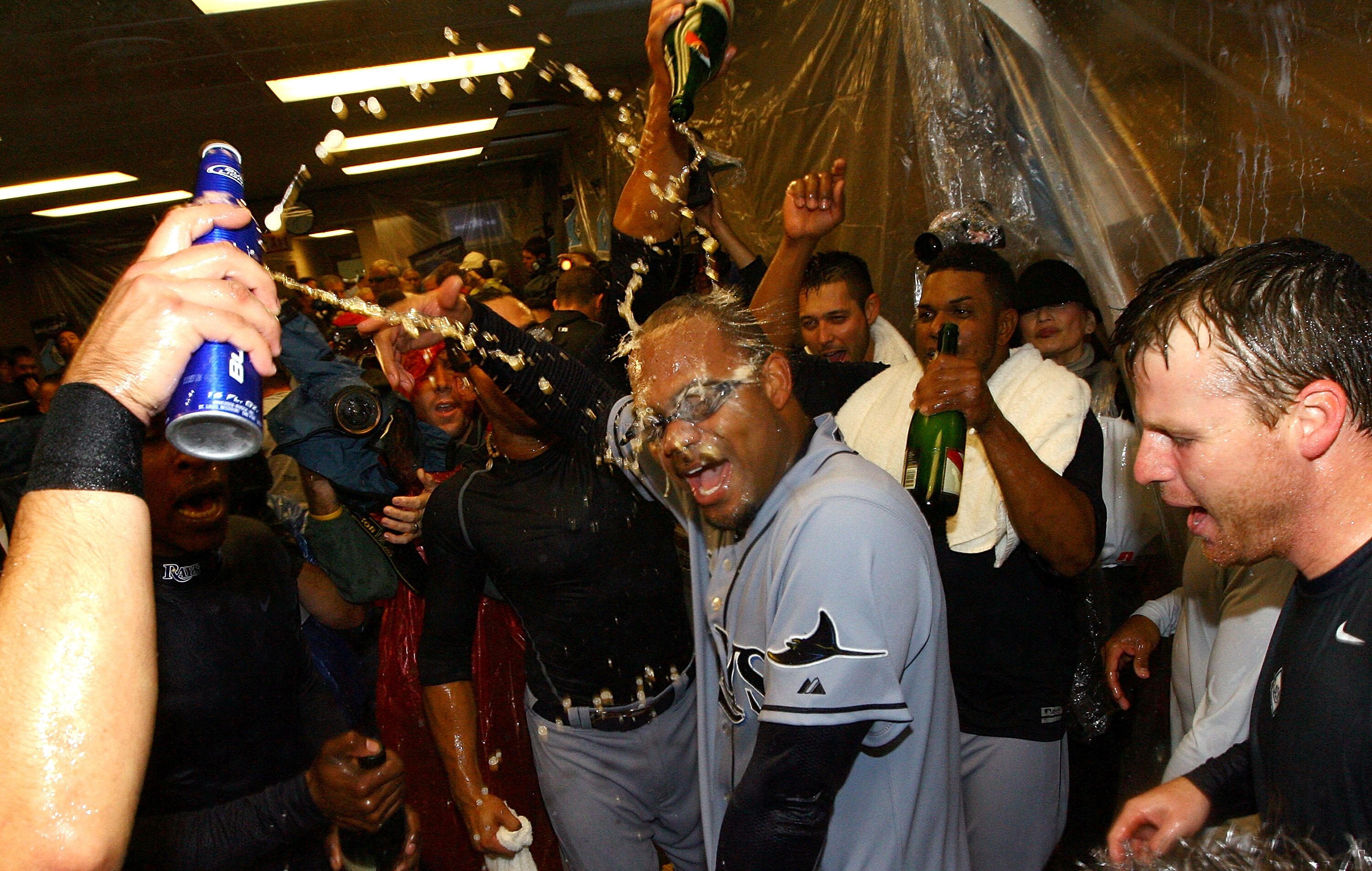 CHICAGO - OCTOBER 06:  Carl Crawford #13 (C) of the Tampa Bay Rays celebrates in the locker room with his teammates after their 6-2 win against the Chicago White Sox in Game Four of the ALDS during the 2008 MLB Playoffs at U.S. Cellular Field on October 6