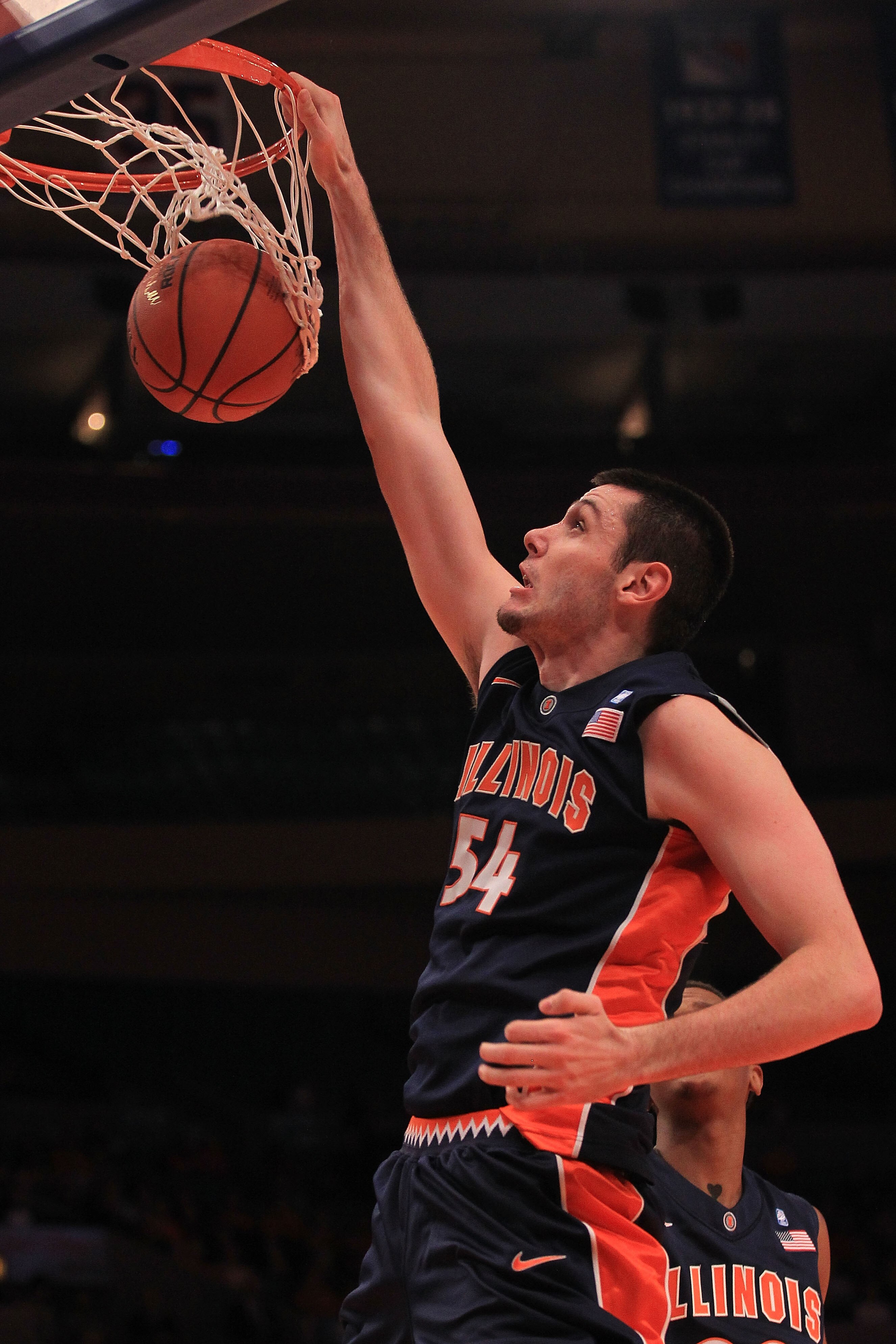 NEW YORK - NOVEMBER 18: Mike Tisdale #54 of the Illinois Fighting Illini slam dunks against the Texas Longhorns during the 2k Sports Classic at Madison Square Garden on November 18, 2010 in New York, New York.  (Photo by Chris McGrath/Getty Images)