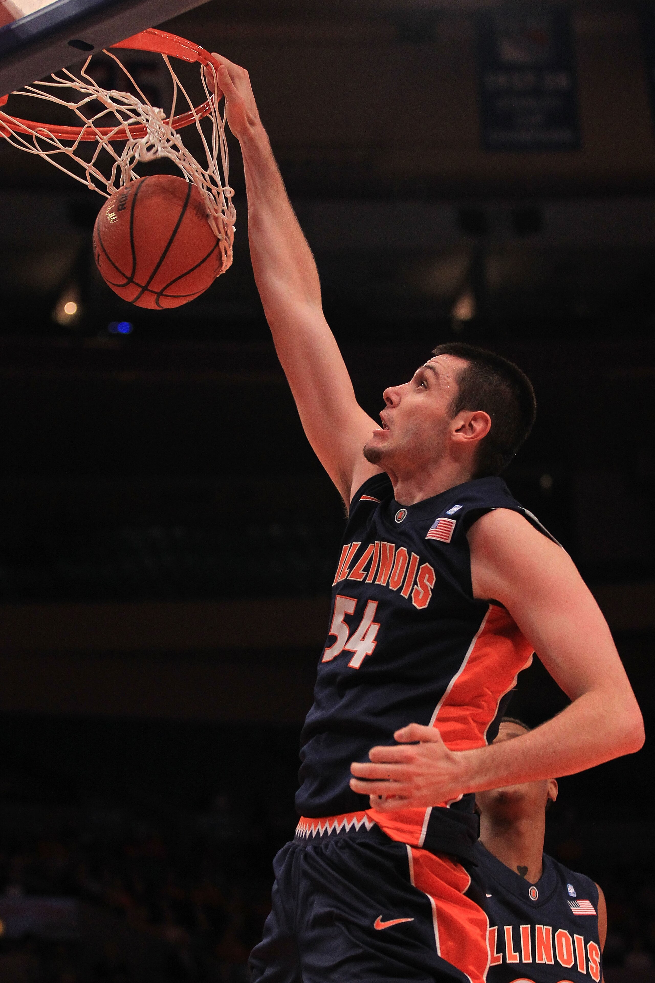 NEW YORK - NOVEMBER 18: Mike Tisdale #54 of the Illinois Fighting Illini slam dunks against the Texas Longhorns during the 2k Sports Classic at Madison Square Garden on November 18, 2010 in New York, New York.  (Photo by Chris McGrath/Getty Images)