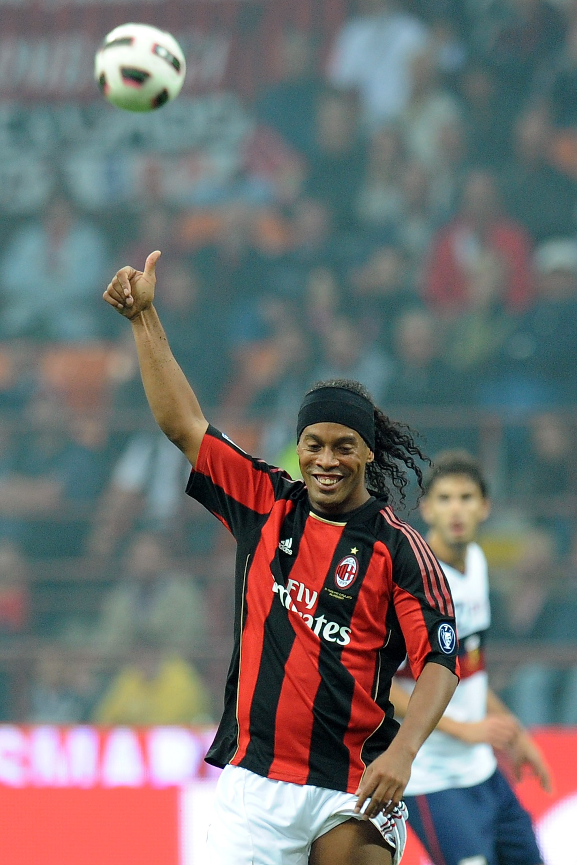 MILAN, ITALY - SEPTEMBER 26:  Ronaldinho of Milan gestures during the Serie A match between AC Milan and Genoa CFC at Stadio Giuseppe Meazza on September 26, 2010 in Milan, Italy.  (Photo by Tullio M. Puglia/Getty Images)