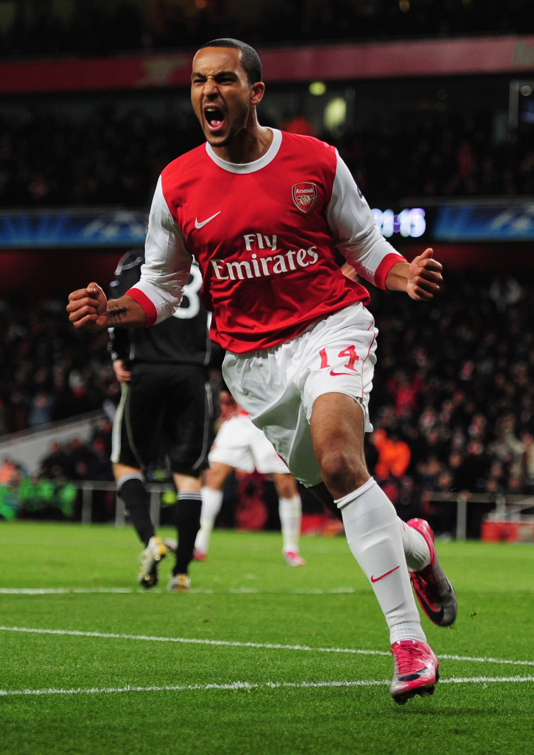 LONDON, ENGLAND - DECEMBER 08:  Theo Walcott of Arsenal celebrates as he scores their second goal during the UEFA Champions League Group H match between Arsenal and FK Partizan Belgrade at the Emirates Stadium on December 8, 2010 in London, England.  (Pho