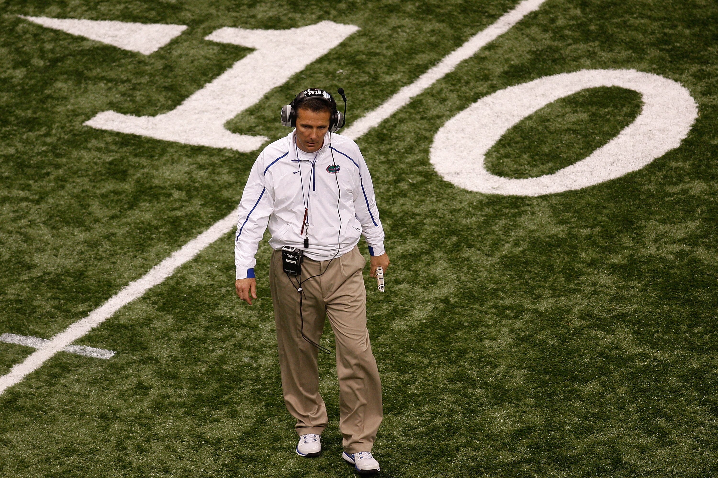 NEW ORLEANS - JANUARY 01:  Head coach Urban Meyer of the Florida Gators walks off the field during a time out in the Allstate Sugar Bowl against the Cincinnati Bearcats at the Louisana Superdome on January 1, 2010 in New Orleans, Louisiana.  (Photo by Chr