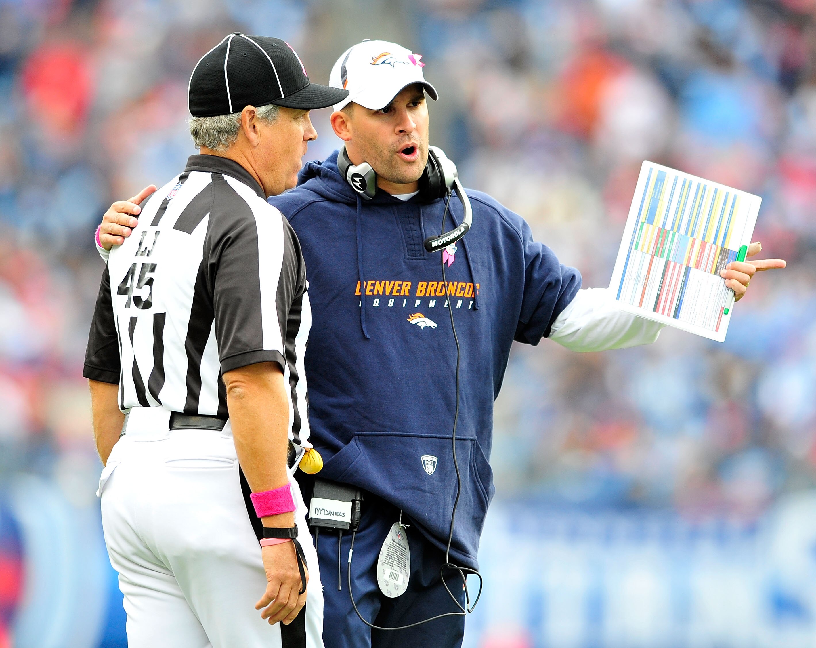 NASHVILLE, TN - OCTOBER 03:  Coach Josh McDaniels of the Denver Broncos confers with an official during a game against the Tennessee Titans  at LP Field on October 3, 2010 in Nashville, Tennessee. Denver won 26-20.  (Photo by Grant Halverson/Getty Images)