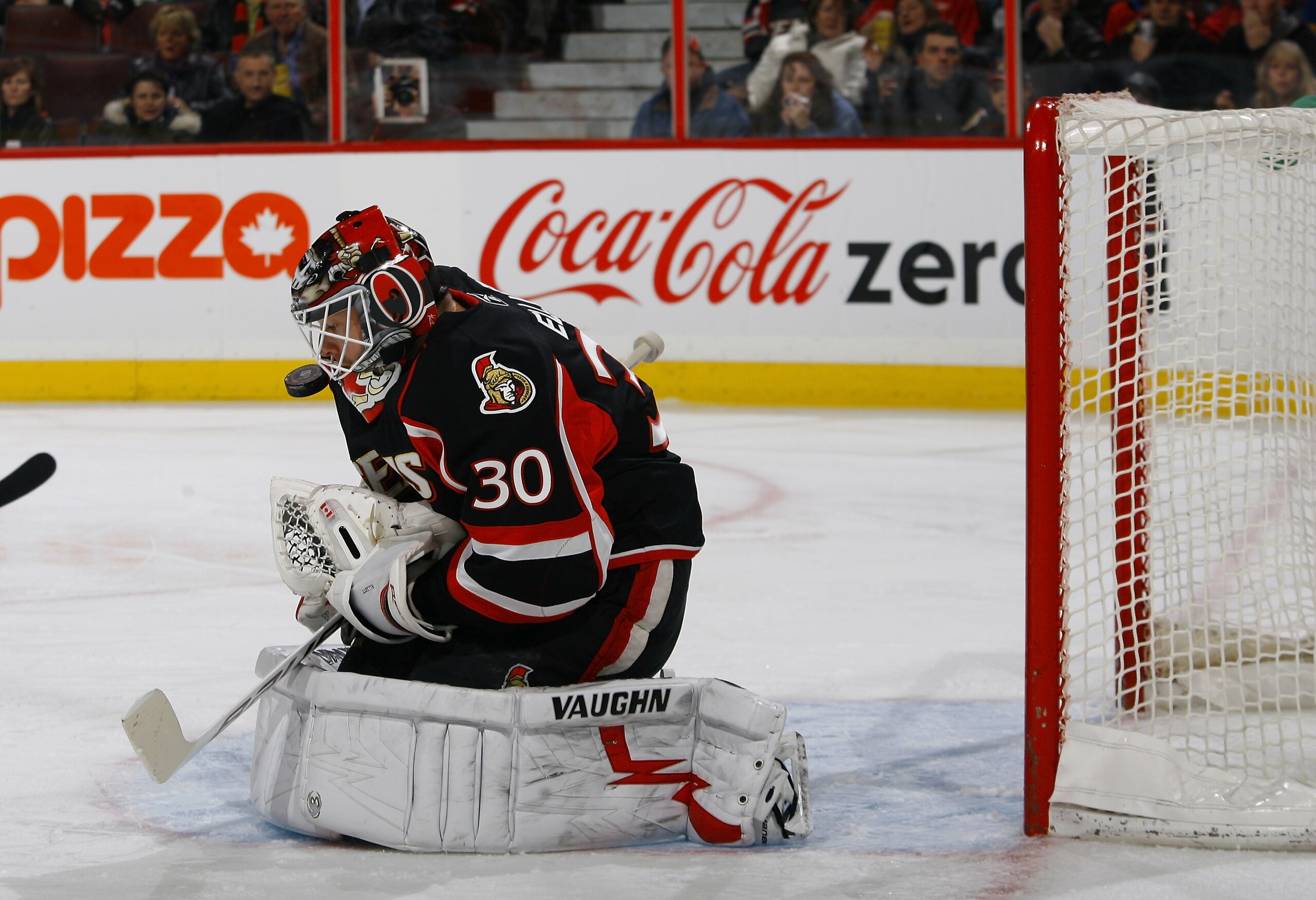 OTTAWA, ON - DECEMBER 04:  Brian Elliott #30 of the Ottawa Senators keeps his eyes on the puck after a rebound in a game against the Buffalo Sabres at Scotiabank Place on December 4, 2010 in Ottawa, Ontario, Canada.  (Photo by Phillip MacCallum/Getty Imag