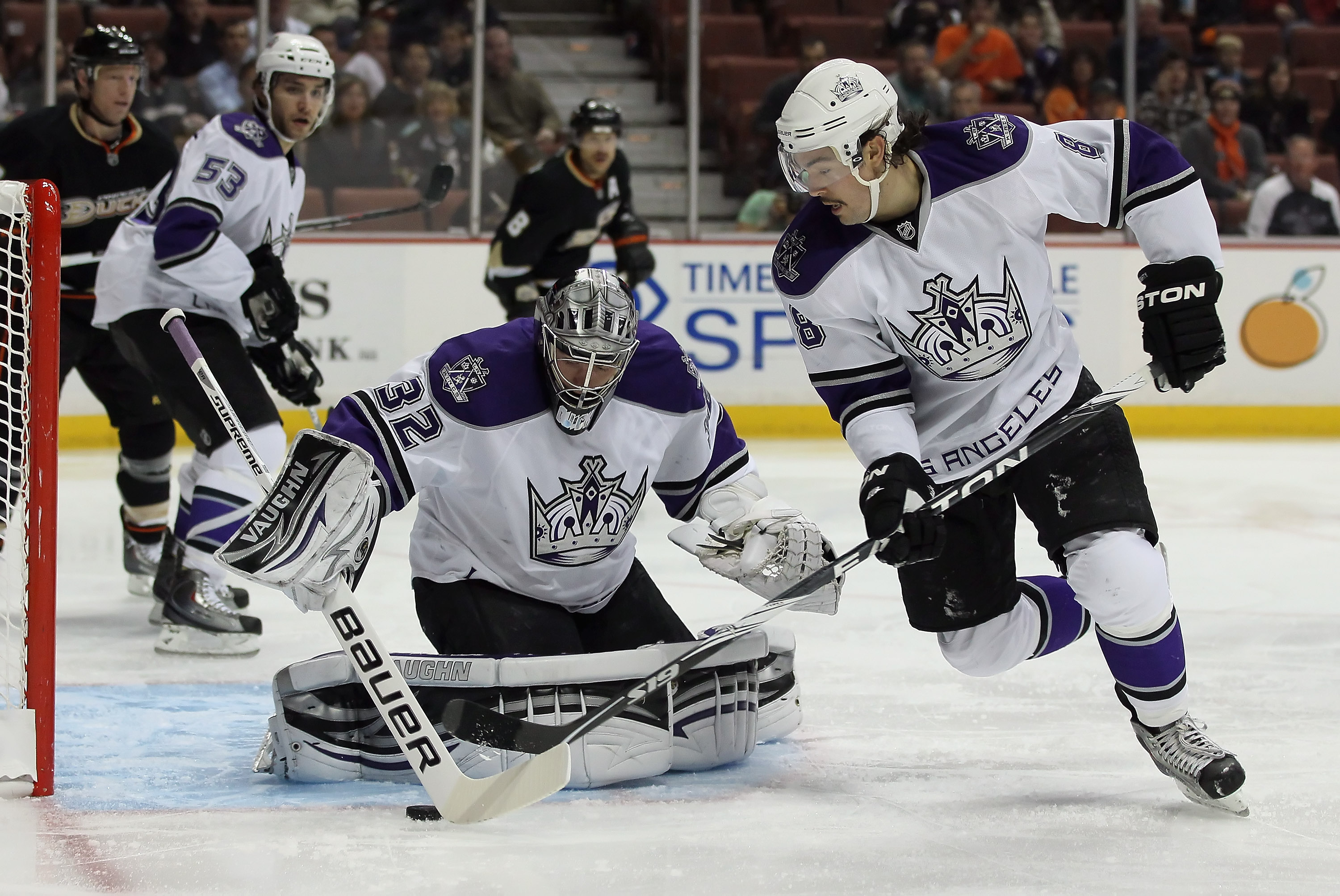 ANAHEIM, CA - NOVEMBER 29:  Goaltender Jonathan Quick #32 of the Los Angeles Kings corrals the puck as temmate Drew Doughty #8 defends against the Anaheim Ducks at the Honda Center on November 29, 2010 in Anaheim, California.  (Photo by Jeff Gross/Getty I