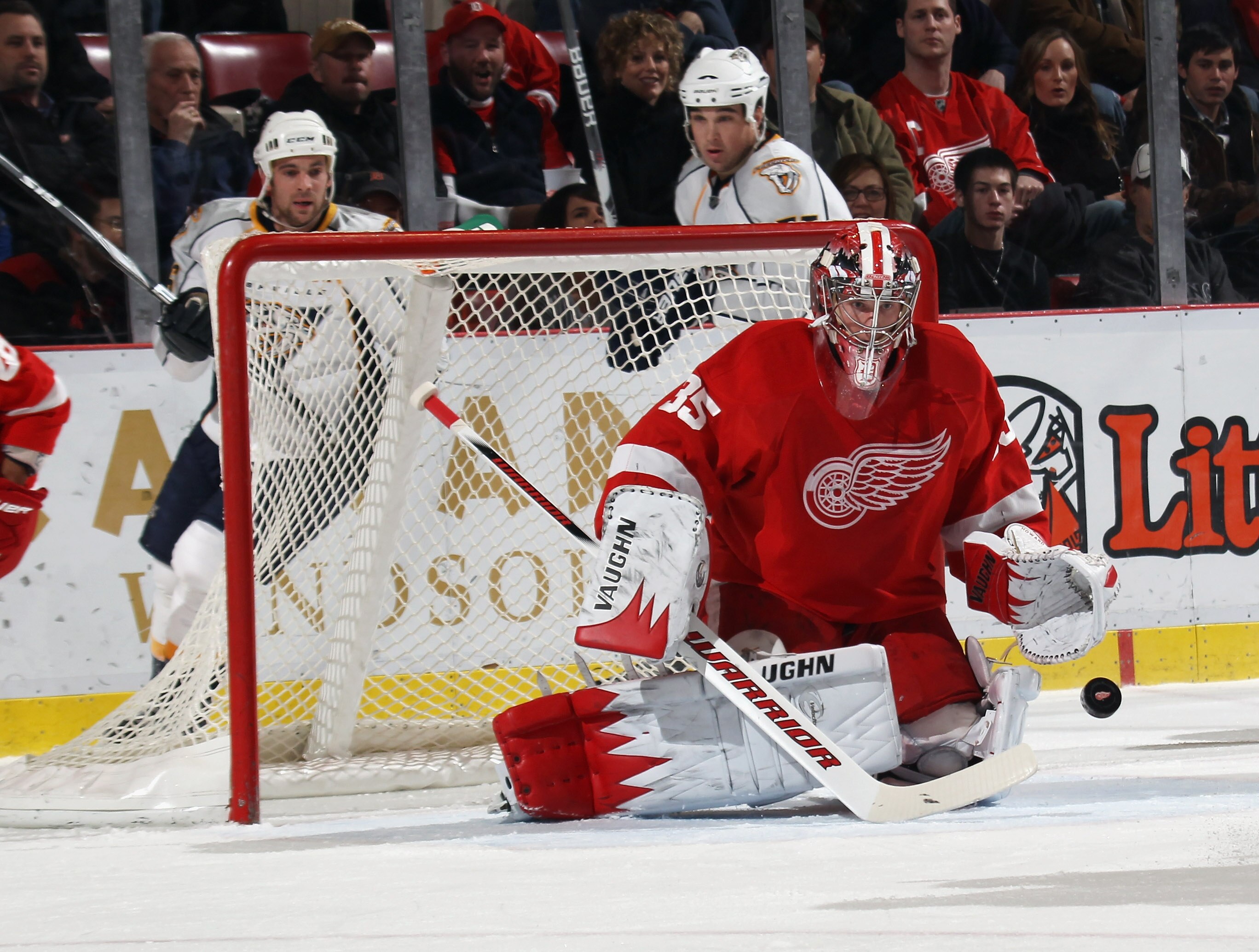 DETROIT, MI - DECEMBER 08:  Jimmy Howard #35 of the Detroit Red Wings makes the stop against the Nashville Predators at the Joe Louis Arena on December 8, 2010 in Detroit, Michigan.  (Photo by Bruce Bennett/Getty Images)