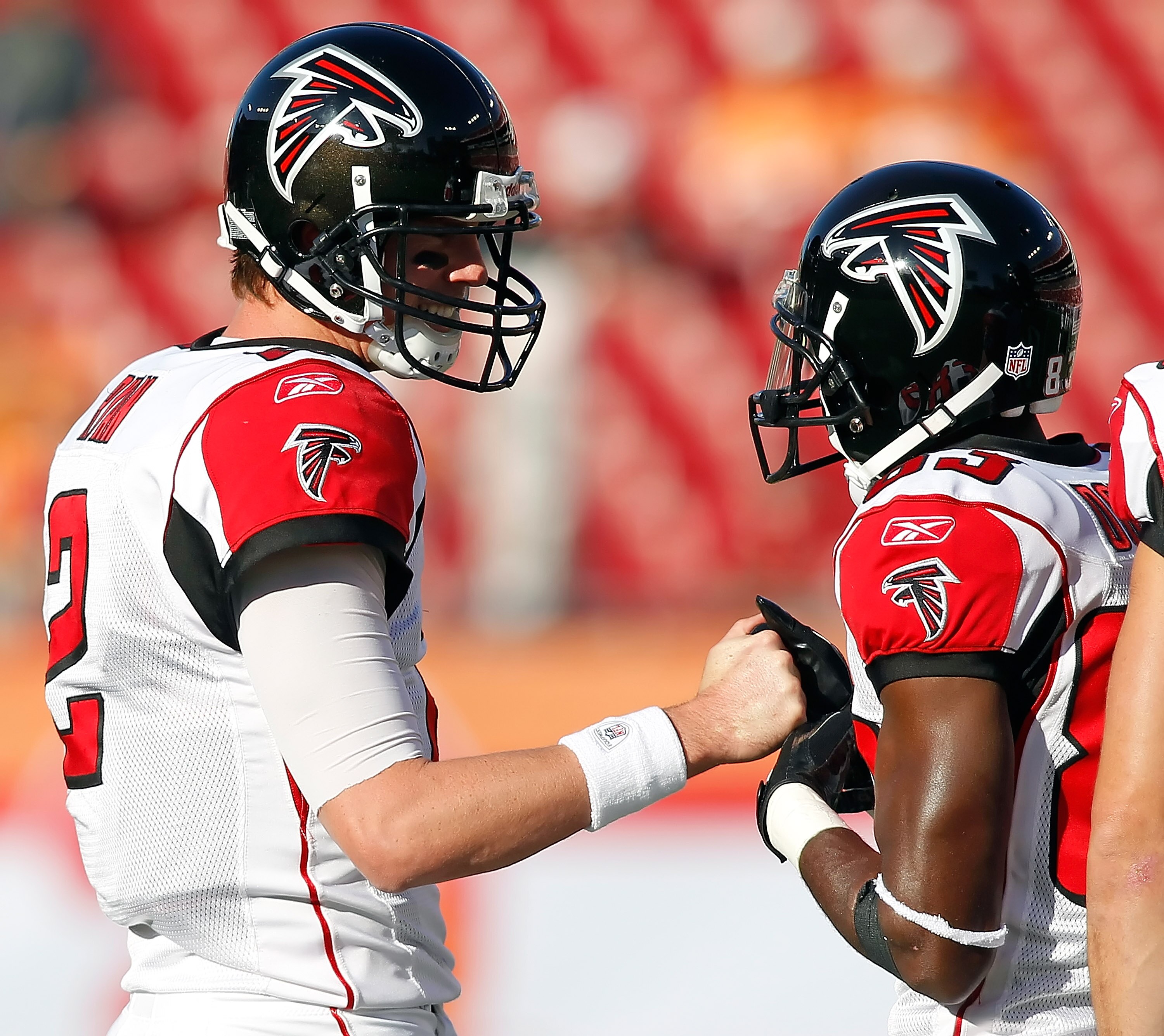 TAMPA, FL - DECEMBER 05:  Quarterback Matt Ryan #2 and receiver Harry Douglas #83 of the Atlanta Falcons talk just before the start of the game against the Tampa Bay Buccaneers at Raymond James Stadium on December 5, 2010 in Tampa, Florida.  (Photo by J. 