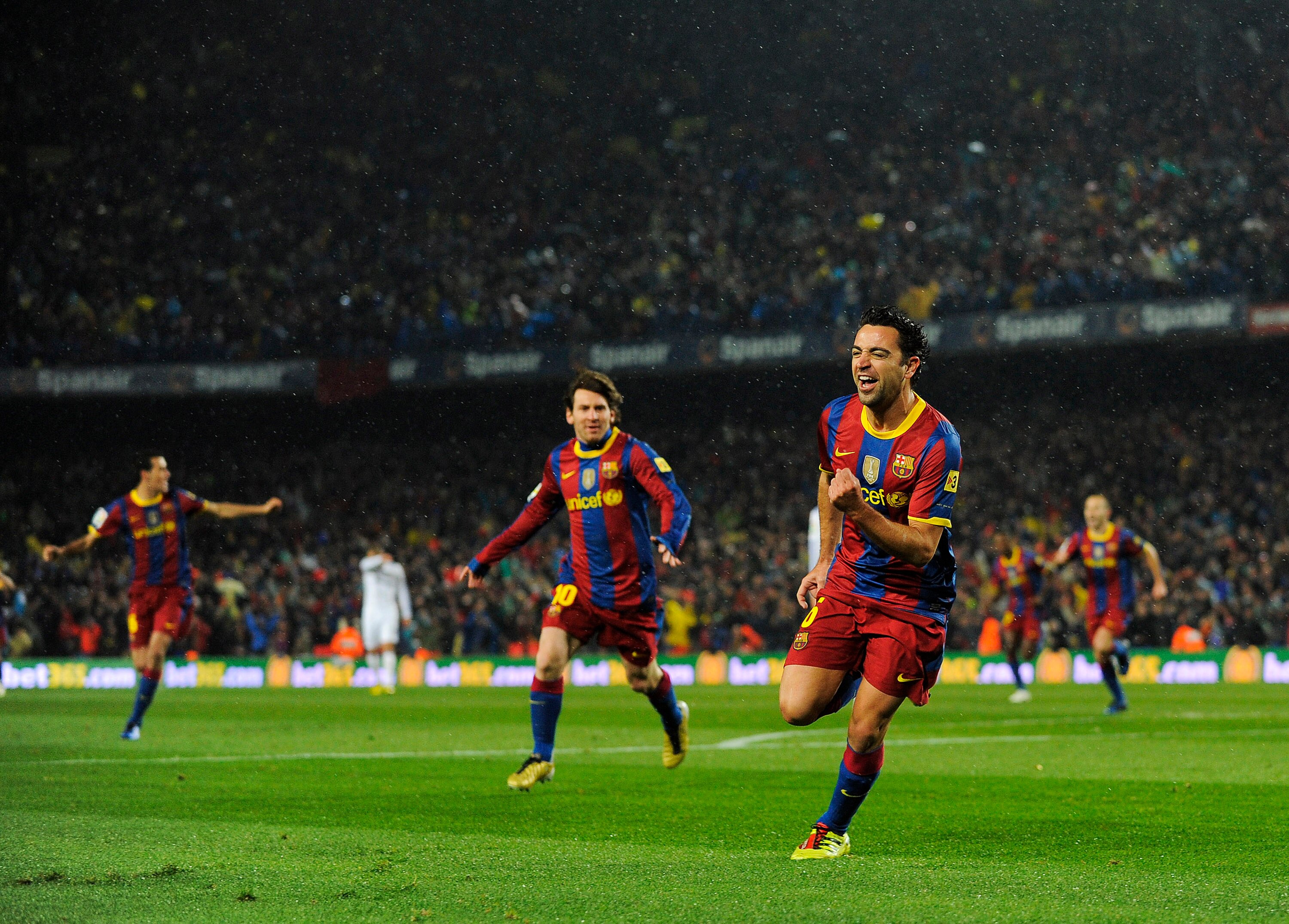 BARCELONA, SPAIN - NOVEMBER 29:  Xavi Hernandez of Barcelona celebrates after scoring the first goal during the La Liga match between Barcelona and Real Madrid at the Camp Nou Stadium on November 29, 2010 in Barcelona, Spain.  Barcelona won the match 5-0.