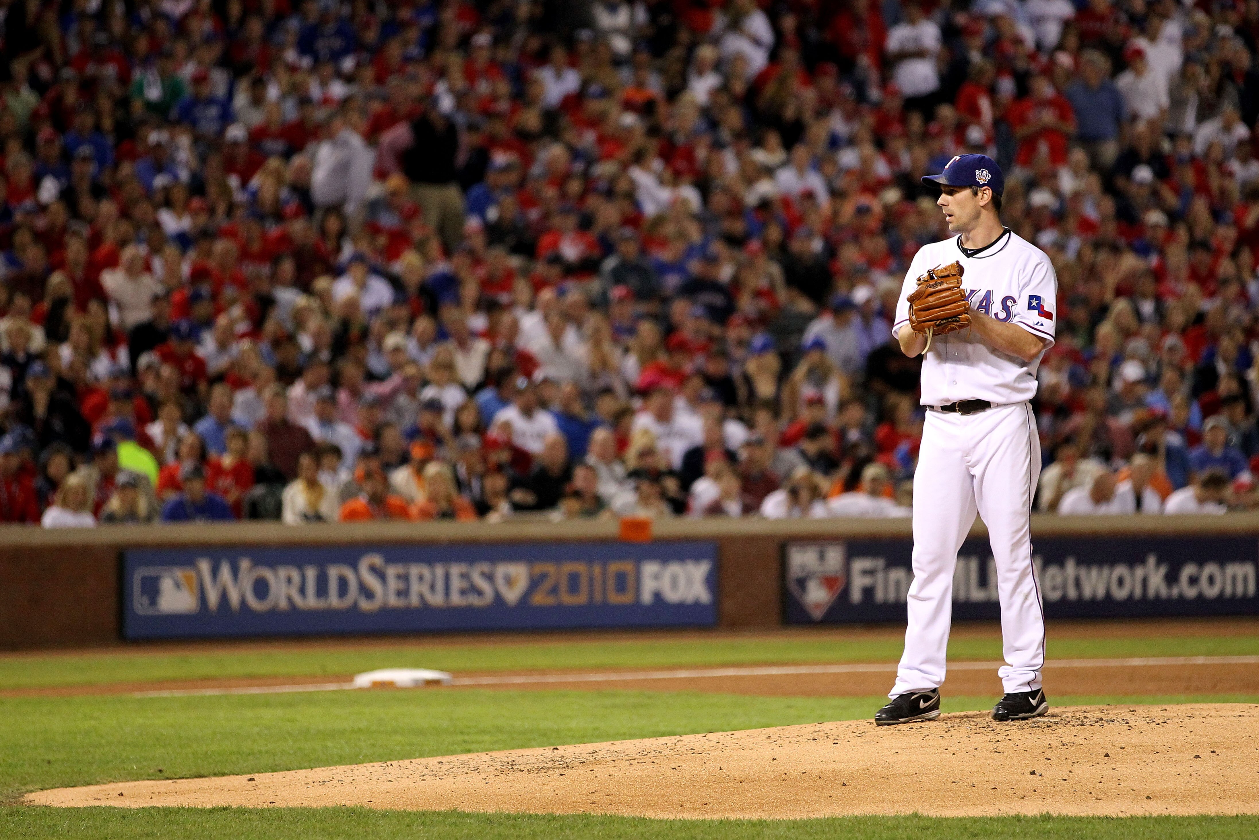 ARLINGTON, TX - NOVEMBER 01:  Starting pitcher Cliff Lee #33 of the Texas Rangers gets set to throw a pitch against the San Francisco Giants in Game Five of the 2010 MLB World Series at Rangers Ballpark in Arlington on November 1, 2010 in Arlington, Texas