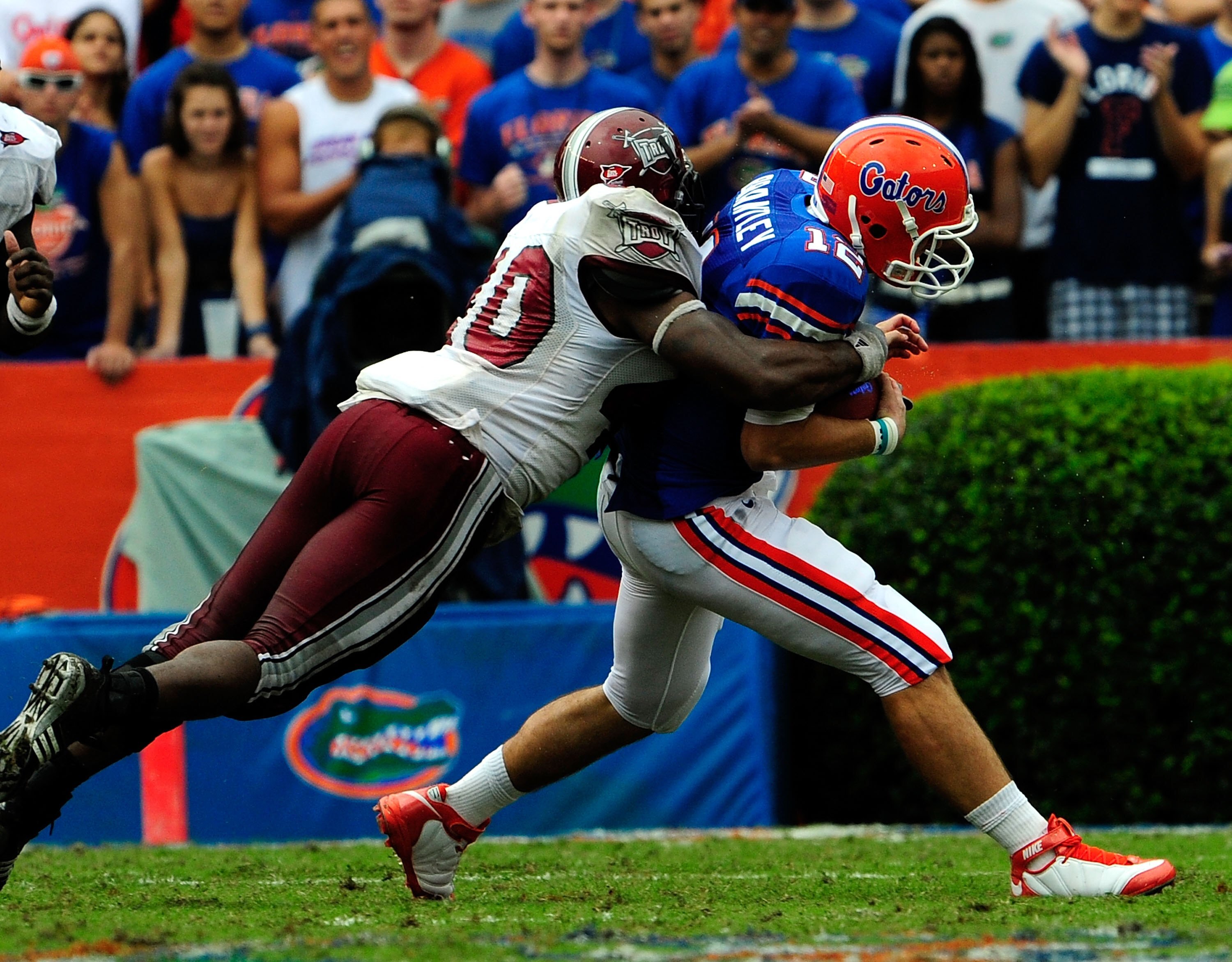 GAINESVILLE, FL - SEPTEMBER 12:  John Brantley #12 of the Florida Gators is tackled by Donnell Golden #40 of the Troy Trojans during the game at Ben Hill Griffin Stadium on September 12, 2009 in Gainesville, Florida.  (Photo by Sam Greenwood/Getty Images)