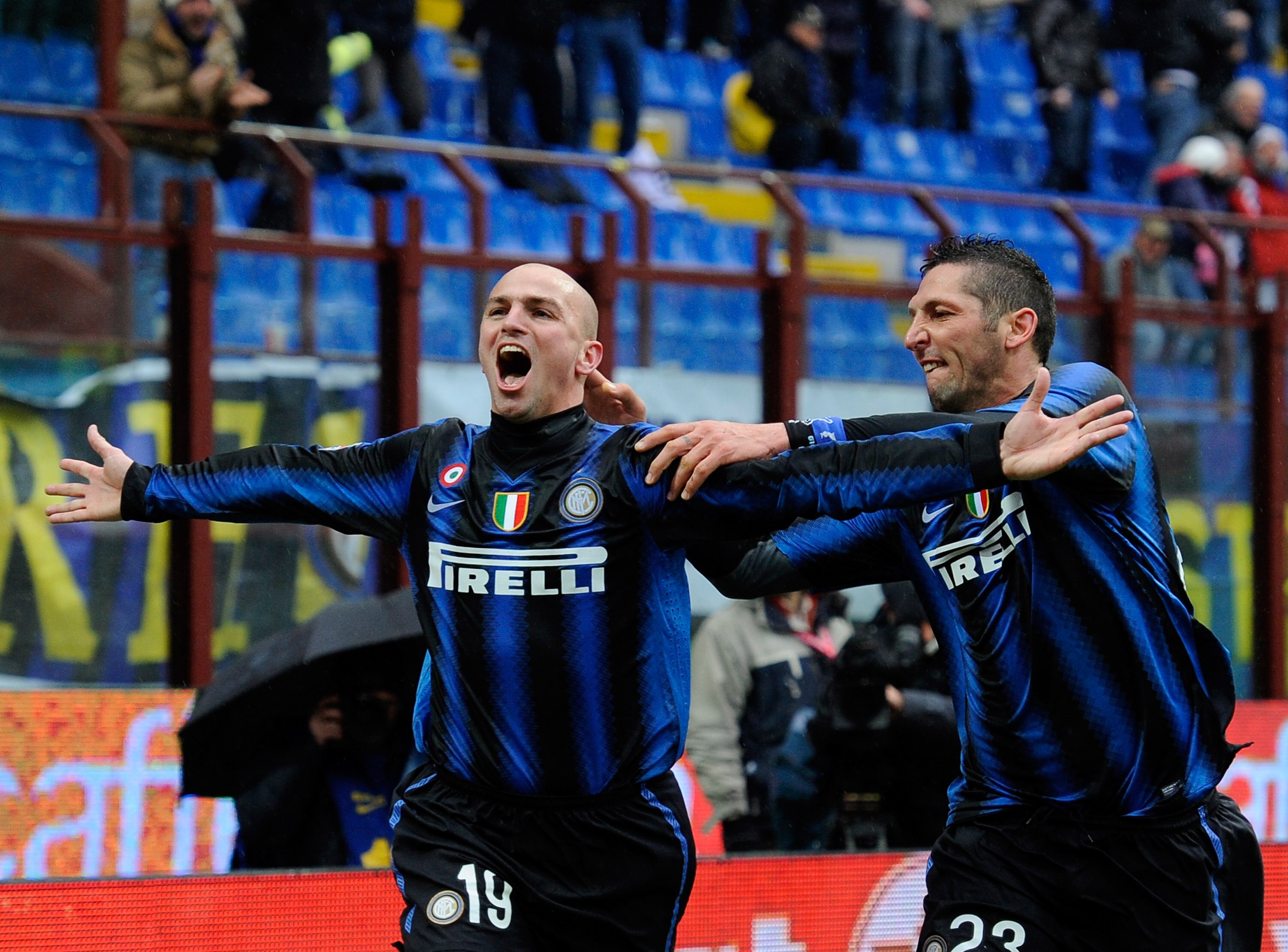 MILAN, ITALY - NOVEMBER 28:  Esteban Cambiasso and Marco Materazzi of FC Internazionale Milano celebrate scoring the first goal during the Serie A match between Inter and Parma at Stadio Giuseppe Meazza on November 28, 2010 in Milan, Italy.  (Photo by Cla