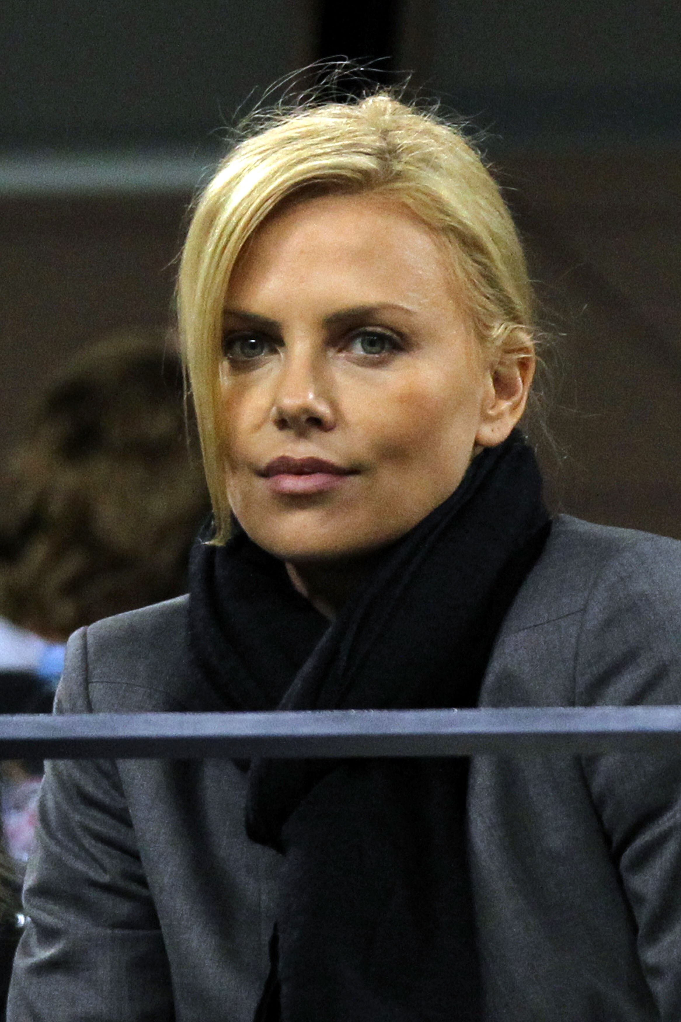 NEW YORK - SEPTEMBER 11:  Charlize Theron watches the women's singles final between Kim Clijsters of Belguim and Vera Zvonareva of Russia on day thirteen of the 2010 U.S. Open at the USTA Billie Jean King National Tennis Center on September 11, 2010 in th