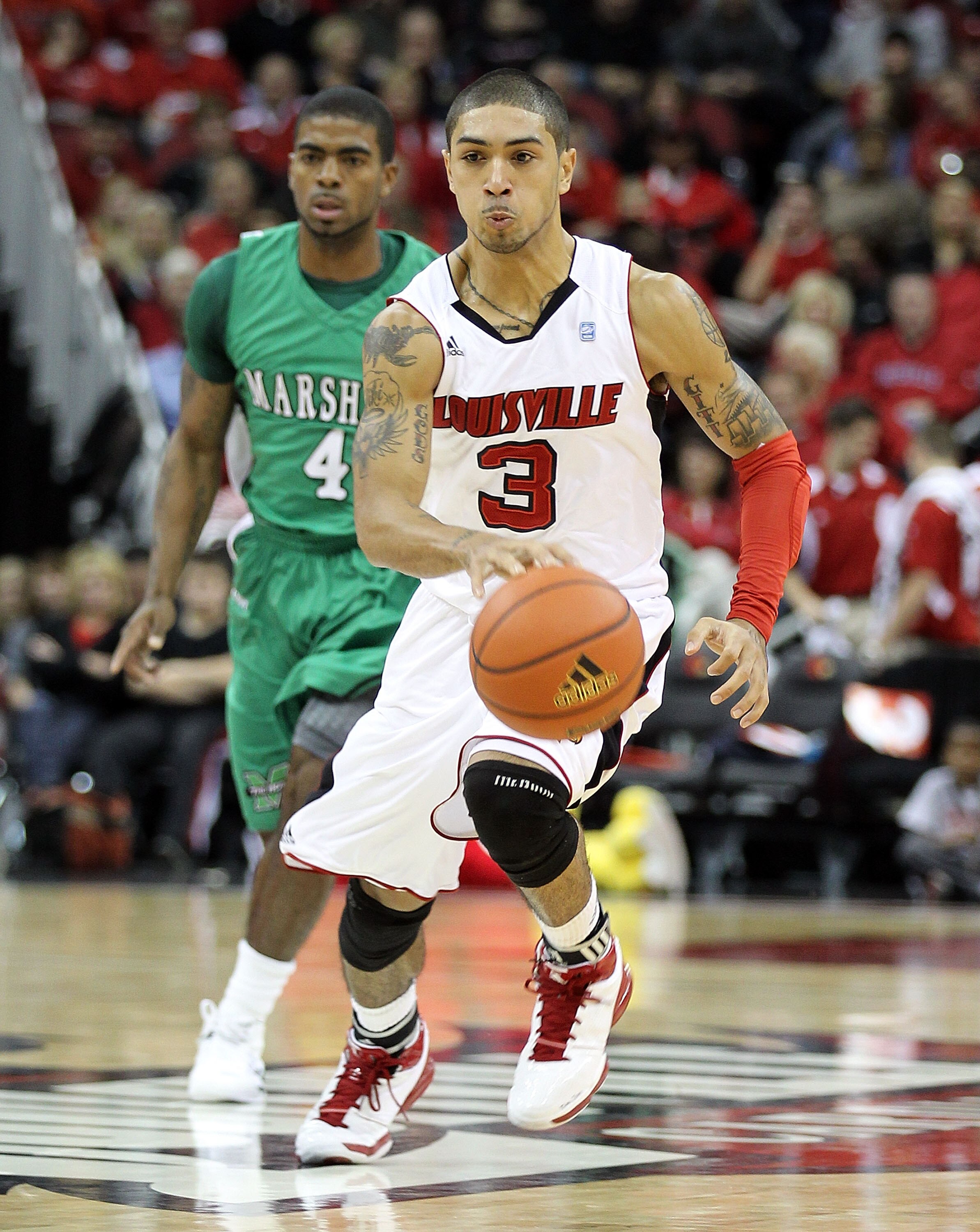 LOUISVILLE, KY - NOVEMBER 27:  Peyton Siva #3 of the Louisville Cardinals dribbles the ball during the game against the Marshall Thundering Herd at the KFC Yum! Center on November 27, 2010 in Louisville, Kentucky.  (Photo by Andy Lyons/Getty Images)