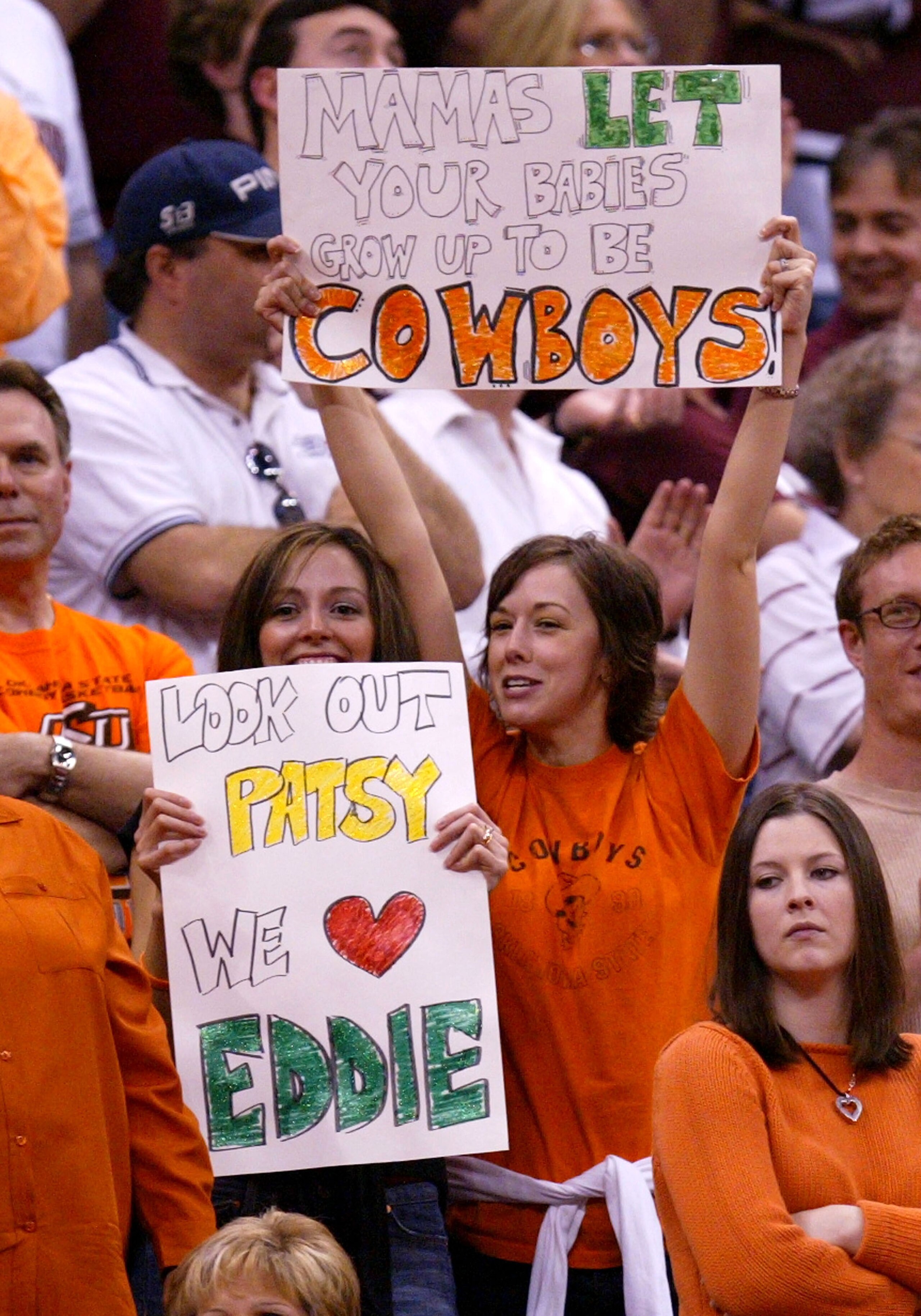 OKLAHOMA CITY - MARCH 20:  Oklahoma State Cowboys fans hold up signs in the second half of the game against the Southern Illinois Salukis during the second round of the NCAA Men's Basketball Championship on March 20, 2005 at the Ford Center in Oklahoma Ci