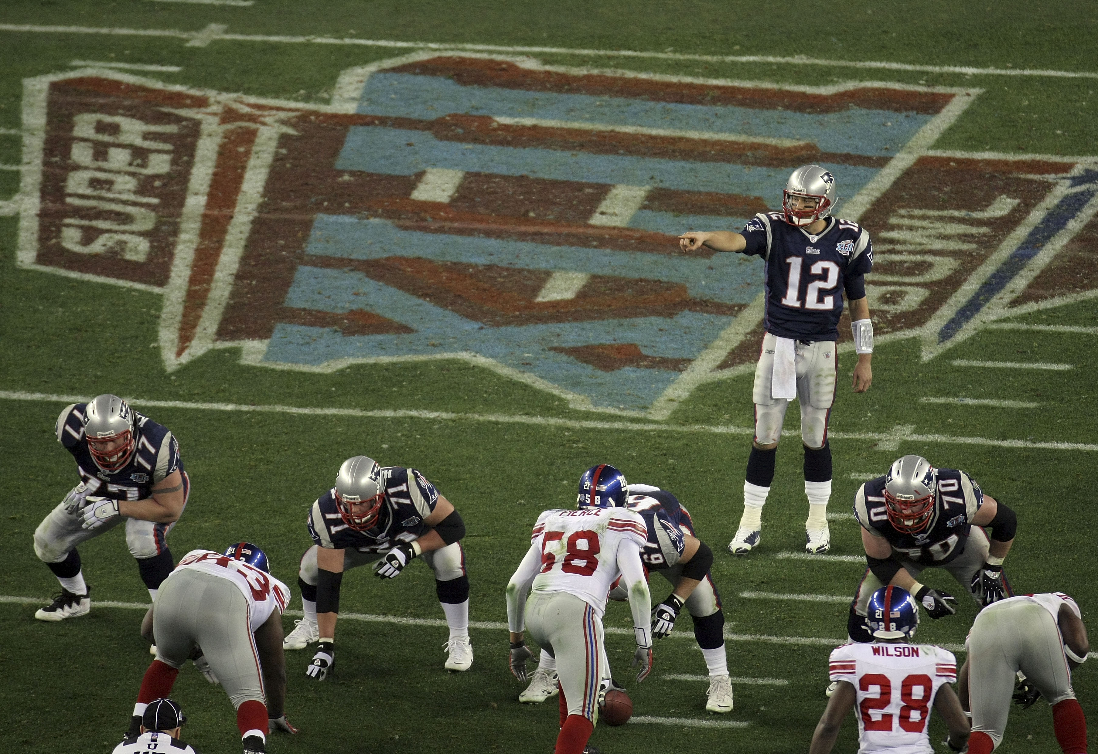 GLENDALE, AZ - FEBRUARY 03:  Tom Brady #12 of the New England Patriots against the New York Giants during Super Bowl XLII on February 3, 2008 at the University of Phoenix Stadium in Glendale, Arizona.  (Photo by Doug Pensinger/Getty Images)