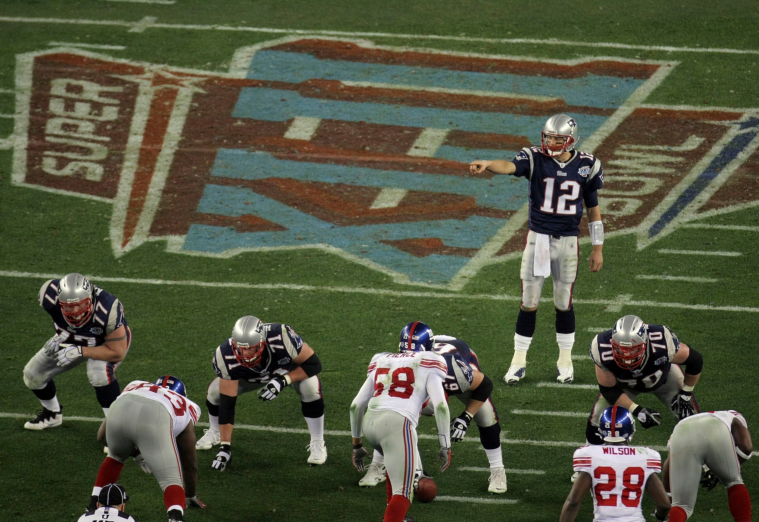 GLENDALE, AZ - FEBRUARY 03: Tom Brady #12 of the New England Patriots against the New York Giants during Super Bowl XLII on February 3, 2008 at the University of Phoenix Stadium in Glendale, Arizona. (Photo by Doug Pensinger/Getty Images) GLENDALE, AZ - FEBRUARY 03: Tom Brady #12 of the New England Patriots against the New York Giants during Super Bowl XLII on February 3, 2008 at the University of Phoenix Stadium in Glendale, Arizona. (Photo by Doug Pensinger/Getty Images)