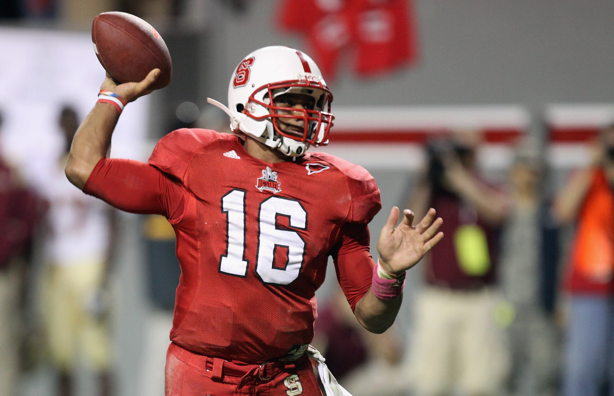 RALEIGH, NC - OCTOBER 28:  Russell Wilson #16 of the North Carolina State Wolfpack throws the game winning touchdown against the Florida State Seminoles during their game at Carter-Finley Stadium on October 28, 2010 in Raleigh, North Carolina.  (Photo by