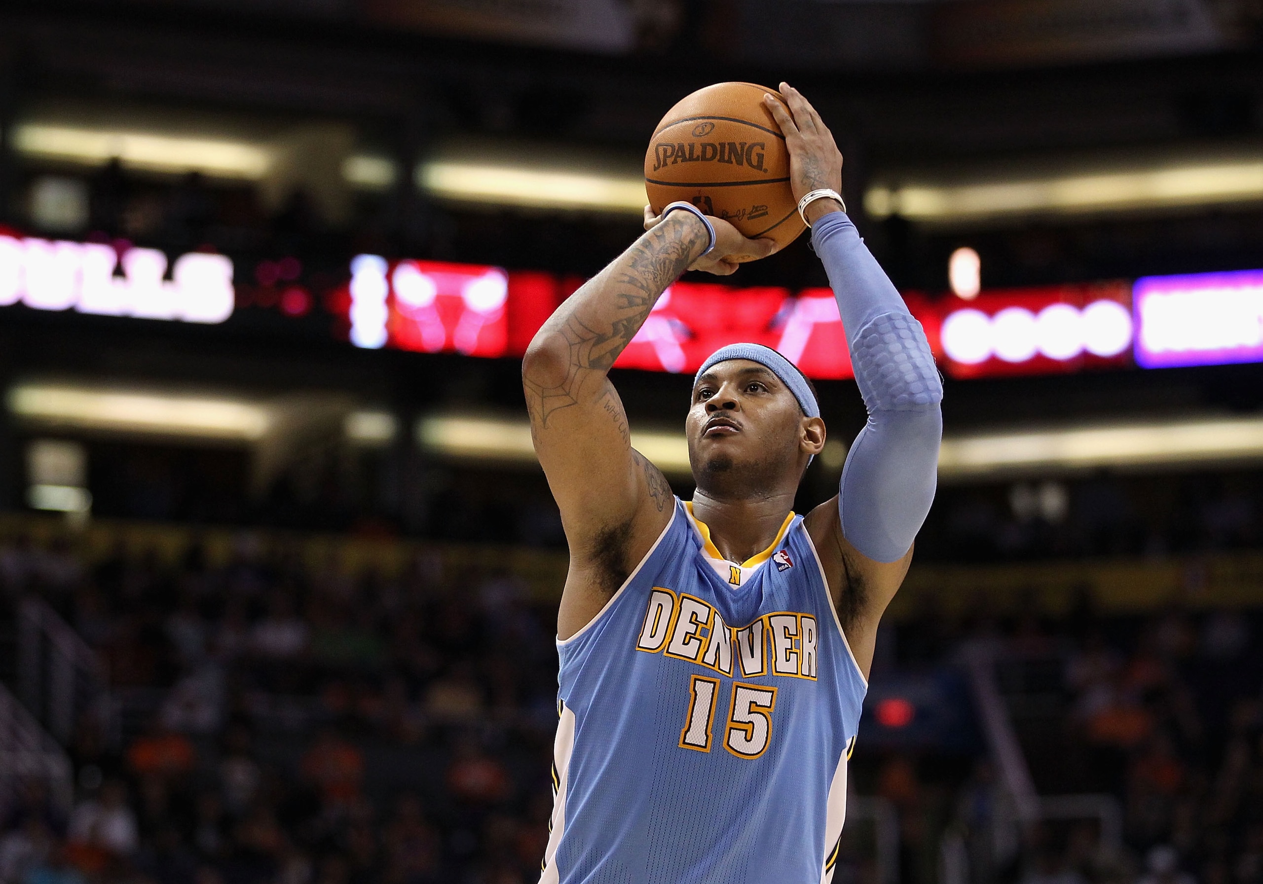 PHOENIX - NOVEMBER 15: Carmelo Anthony #15 of the Denver Nuggets shoots a free throw shot during the NBA game against the Phoenix Suns at US Airways Center on November 15, 2010 in Phoenix, Arizona. The Suns defeated the Nuggets 100-94. NOTE TO USER: Us PHOENIX - NOVEMBER 15: Carmelo Anthony #15 of the Denver Nuggets shoots a free throw shot during the NBA game against the Phoenix Suns at US Airways Center on November 15, 2010 in Phoenix, Arizona. The Suns defeated the Nuggets 100-94. NOTE TO USER: Us