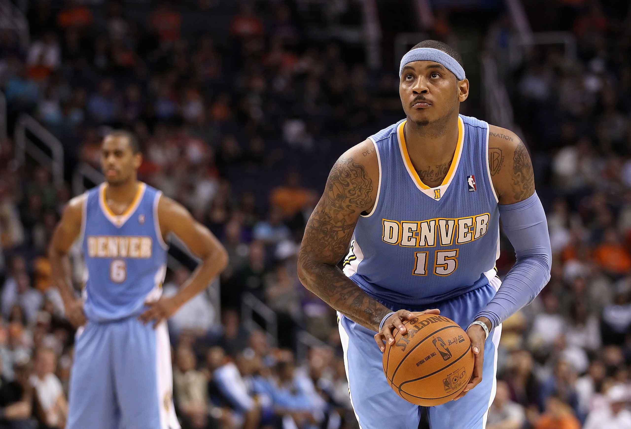 PHOENIX - NOVEMBER 15: Carmelo Anthony #15 of the Denver Nuggets shoots a free throw shot during the NBA game against the Phoenix Suns at US Airways Center on November 15, 2010 in Phoenix, Arizona. The Suns defeated the Nuggets 100-94. NOTE TO USER: Us PHOENIX - NOVEMBER 15: Carmelo Anthony #15 of the Denver Nuggets shoots a free throw shot during the NBA game against the Phoenix Suns at US Airways Center on November 15, 2010 in Phoenix, Arizona. The Suns defeated the Nuggets 100-94. NOTE TO USER: Us