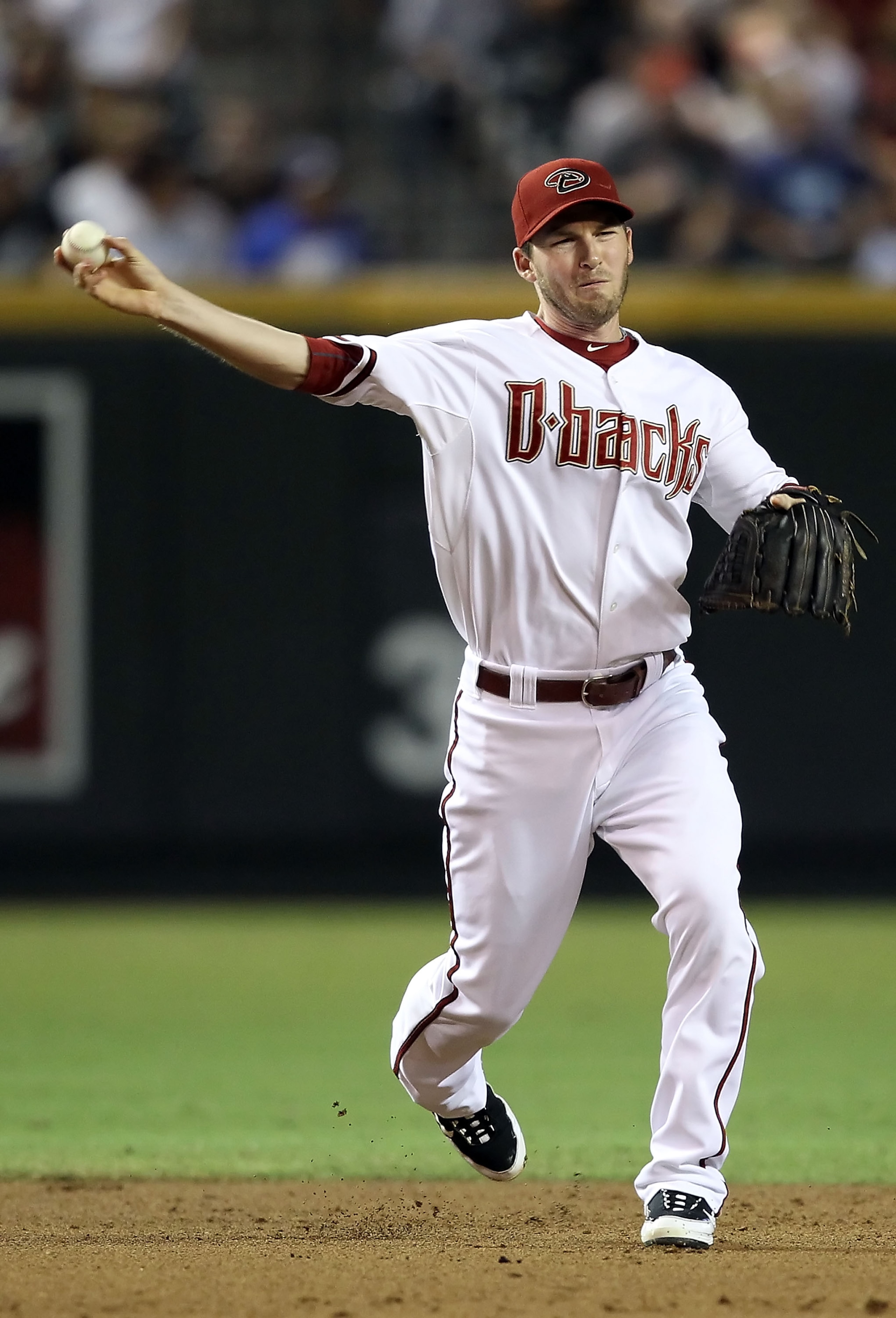 PHOENIX - SEPTEMBER 24:  Infielder Stephen Drew #6 of the Arizona Diamondbacks fields a ground ball out during the Major League Baseball game against the Los Angeles Dodgers at Chase Field on September 24, 2010 in Phoenix, Arizona.  (Photo by Christian Pe