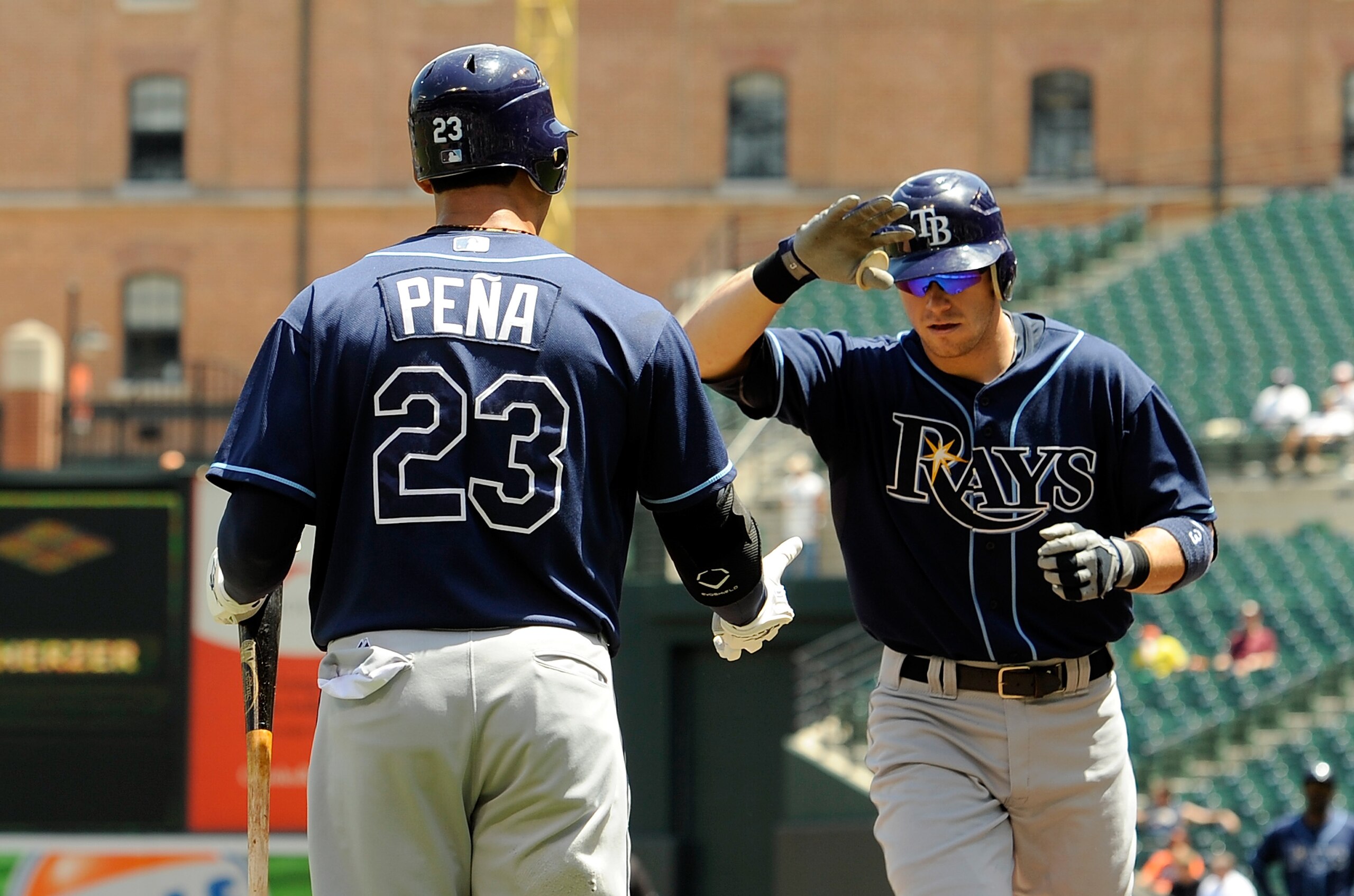 BALTIMORE - JULY 21:  Evan Longoria #3 of the Tampa Bay Rays is congratulated by Carlos Pena #23 after hitting a home run in the first inning against the Baltimore Orioles at Camden Yards on July 21, 2010 in Baltimore, Maryland.  (Photo by Greg Fiume/Gett