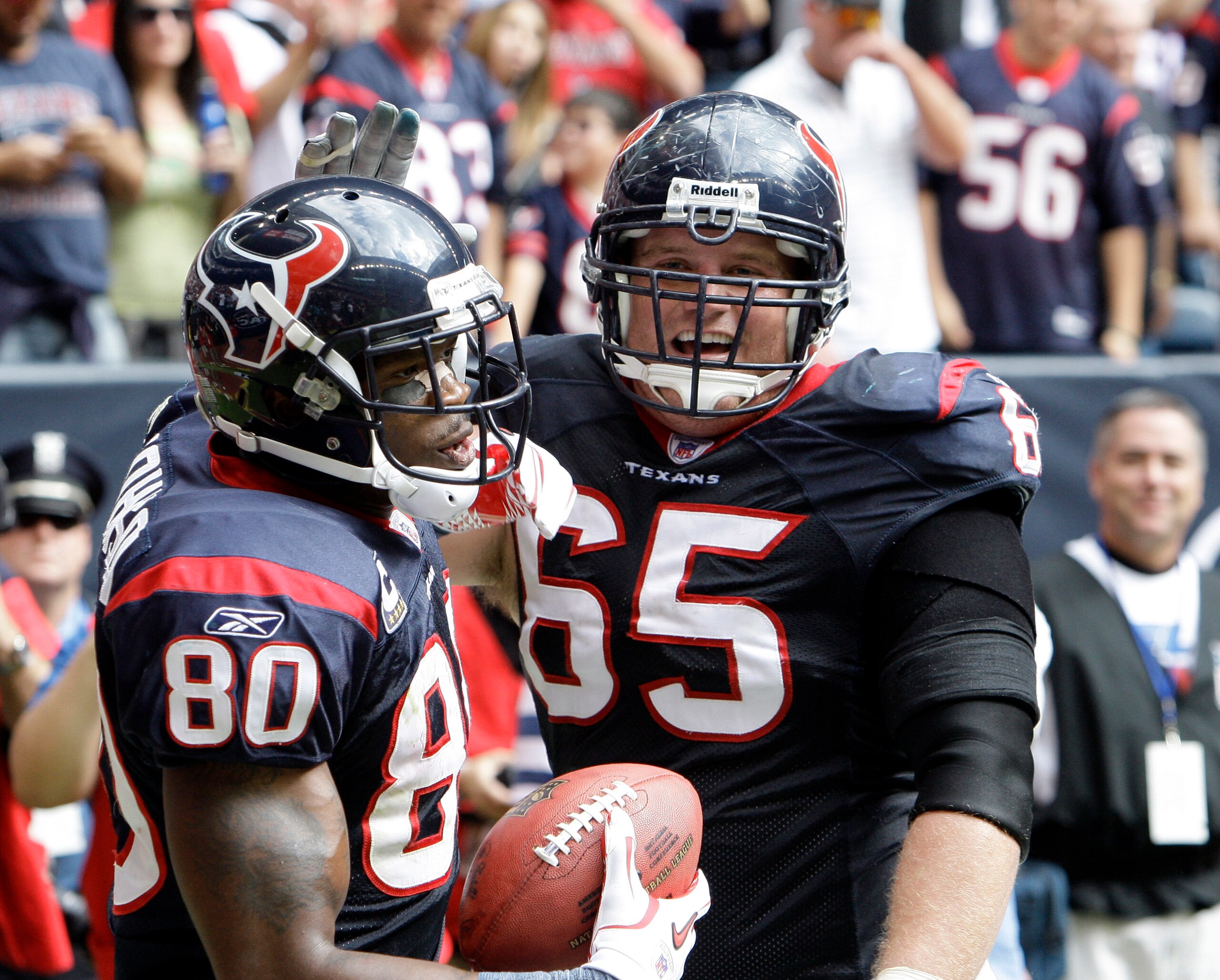 HOUSTON - NOVEMBER 28:  Wide receiver Andre Johnson #80 of the Houston Texans is congratulated by Mike Brisiel after scoring in the first quarter at Reliant Stadium on November 28, 2010 in Houston, Texas.  (Photo by Bob Levey/Getty Images)