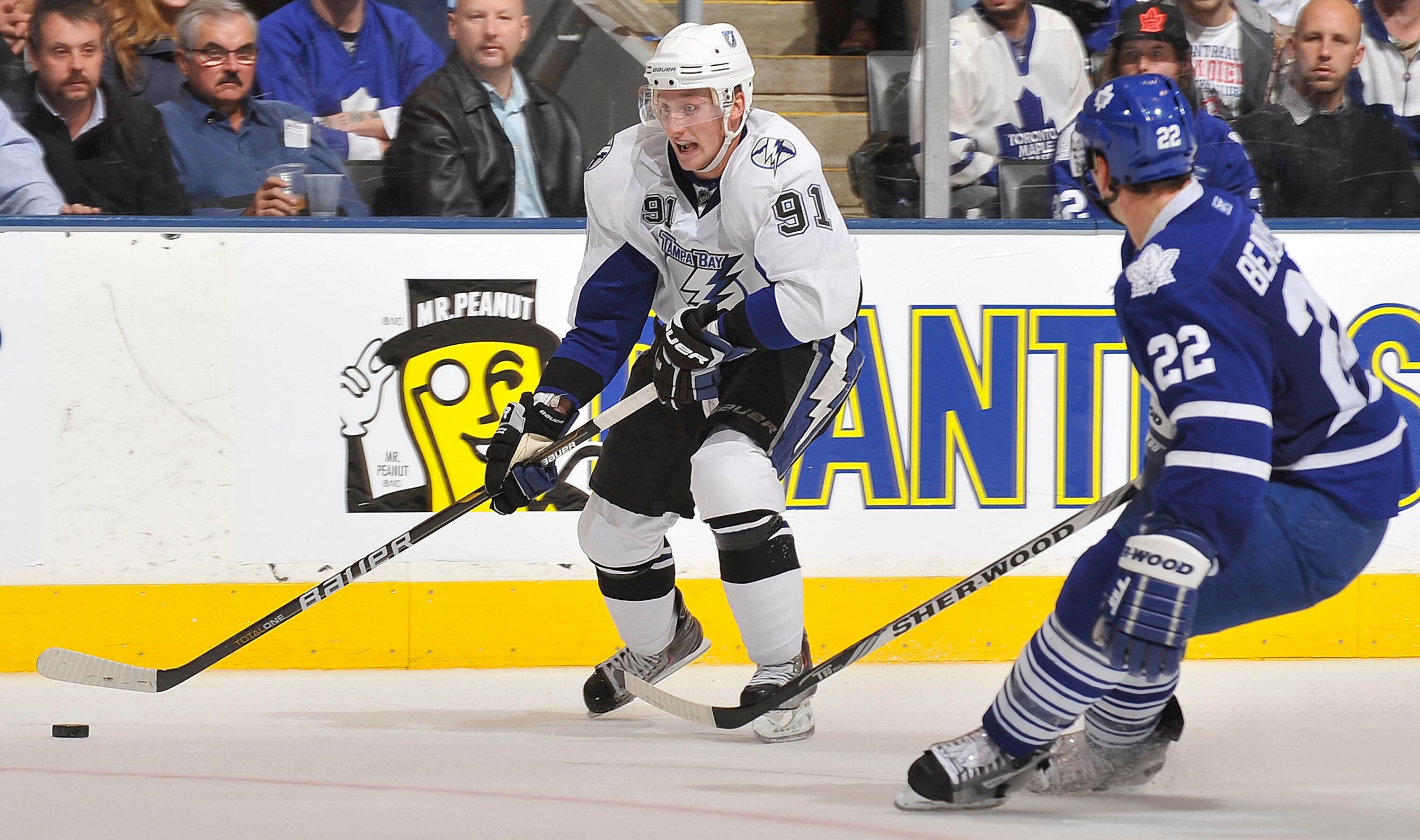 TORONTO, CANADA - NOVEMBER 30:  Steven Stamkos #91of the Tampa Bay Lightning looks to shoot the puck as Francois Beauchemin #22of the Toronto Maple Leafs defends during game action November 30, 2010 at the Air Canada Centre in Toronto, Ontario, Canada. (P