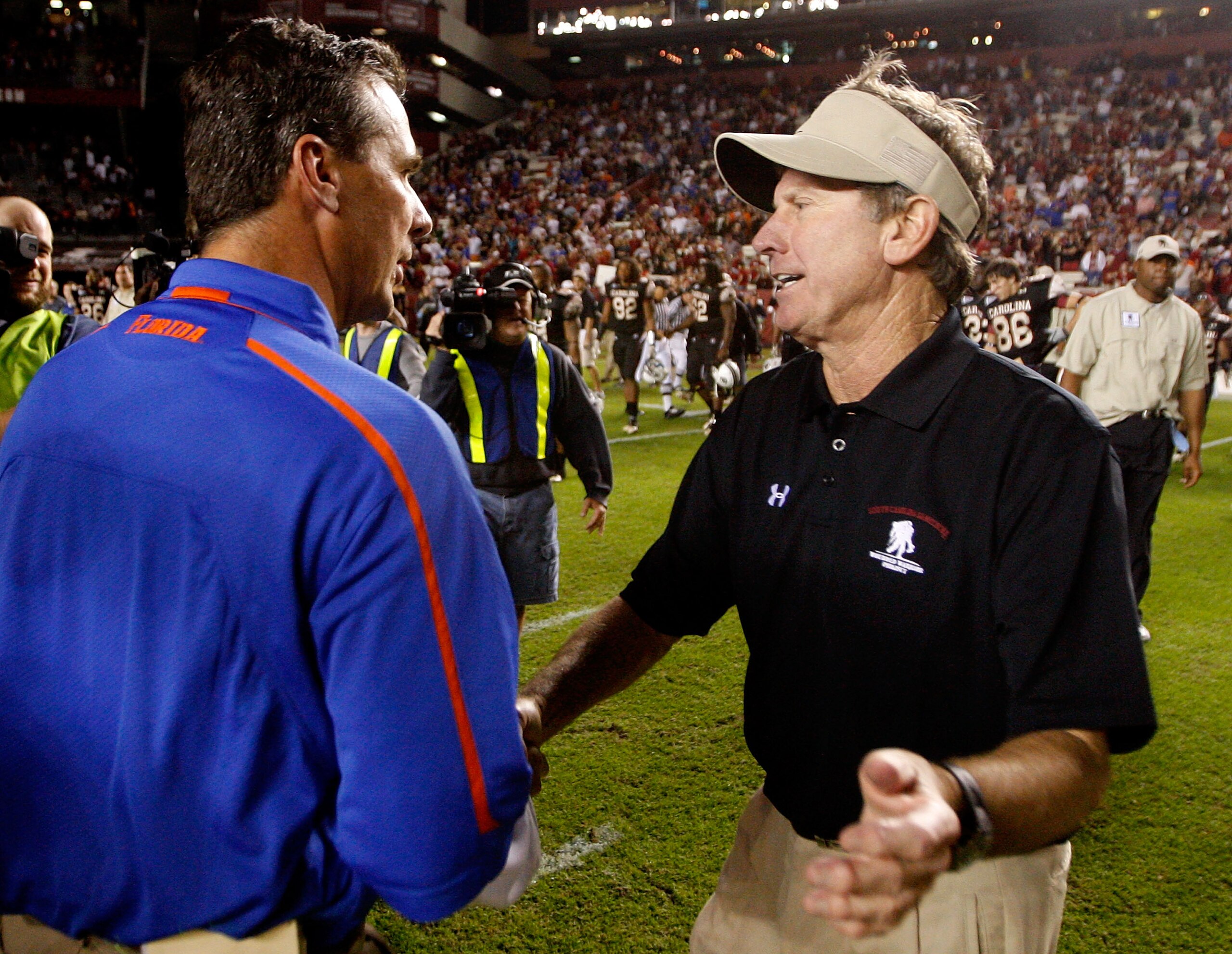 COLUMBIA, SC - NOVEMBER 14: Head coach Urban Meyer (L) of the Florida Gators shakes hands with head coach Steve Spurrier (R) of the South Carolina Gamecocks during their game at Williams-Brice Stadium on November 14, 2009 in Columbia, South Carolina. (P COLUMBIA, SC - NOVEMBER 14: Head coach Urban Meyer (L) of the Florida Gators shakes hands with head coach Steve Spurrier (R) of the South Carolina Gamecocks during their game at Williams-Brice Stadium on November 14, 2009 in Columbia, South Carolina. (P