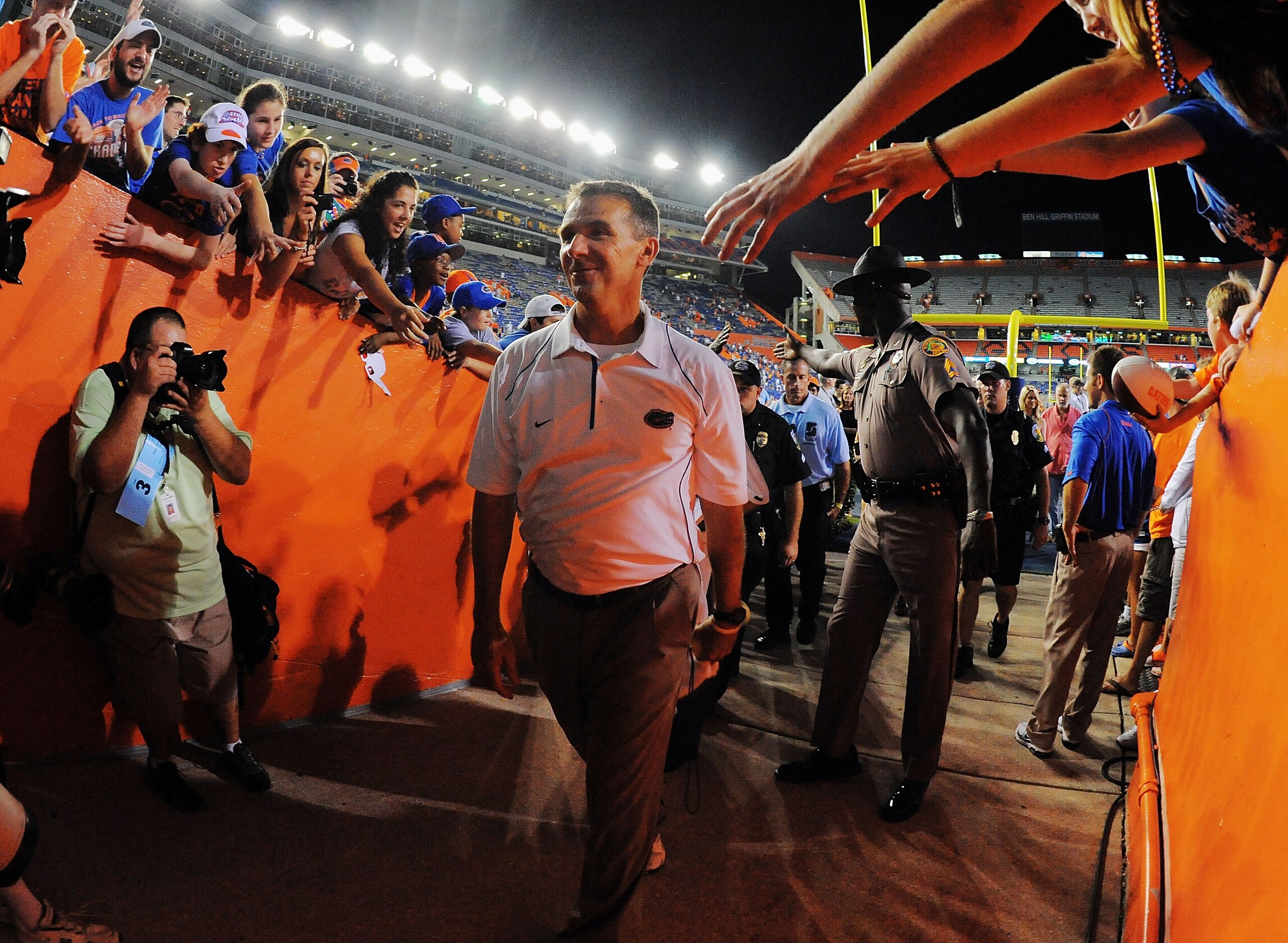 GAINESVILLE, FL - SEPTEMBER 25: Head coach Urban Meyer of the Florida Gators walks off the field after defeating the Kentucky Wildcats at Ben Hill Griffin Stadium on September 25, 2010 in Gainesville, Florida. Florida defeated Kentucky 48-14 for Meyer's GAINESVILLE, FL - SEPTEMBER 25: Head coach Urban Meyer of the Florida Gators walks off the field after defeating the Kentucky Wildcats at Ben Hill Griffin Stadium on September 25, 2010 in Gainesville, Florida. Florida defeated Kentucky 48-14 for Meyer's
