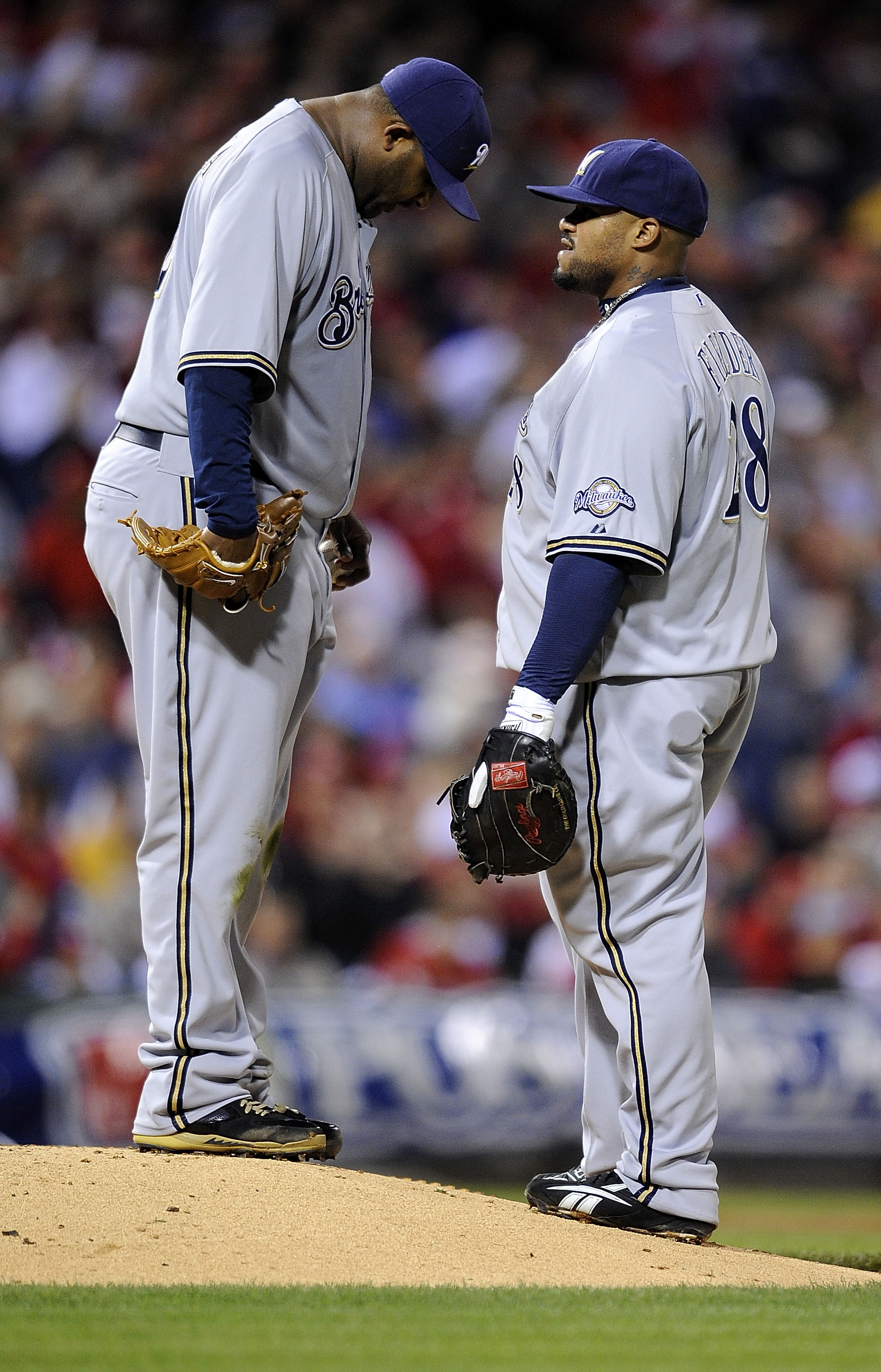 PHILADELPHIA - OCTOBER 02:  CC Sabathia #52 and Prince Fielder #28 of the Milwaukee Brewers confer on the mound in Game 2 of the NLDS Playoff against the Philadelphia Phillies  at Citizens Bank Ballpark on October 2, 2008 in Philadelphia, Pennsylvania  (P