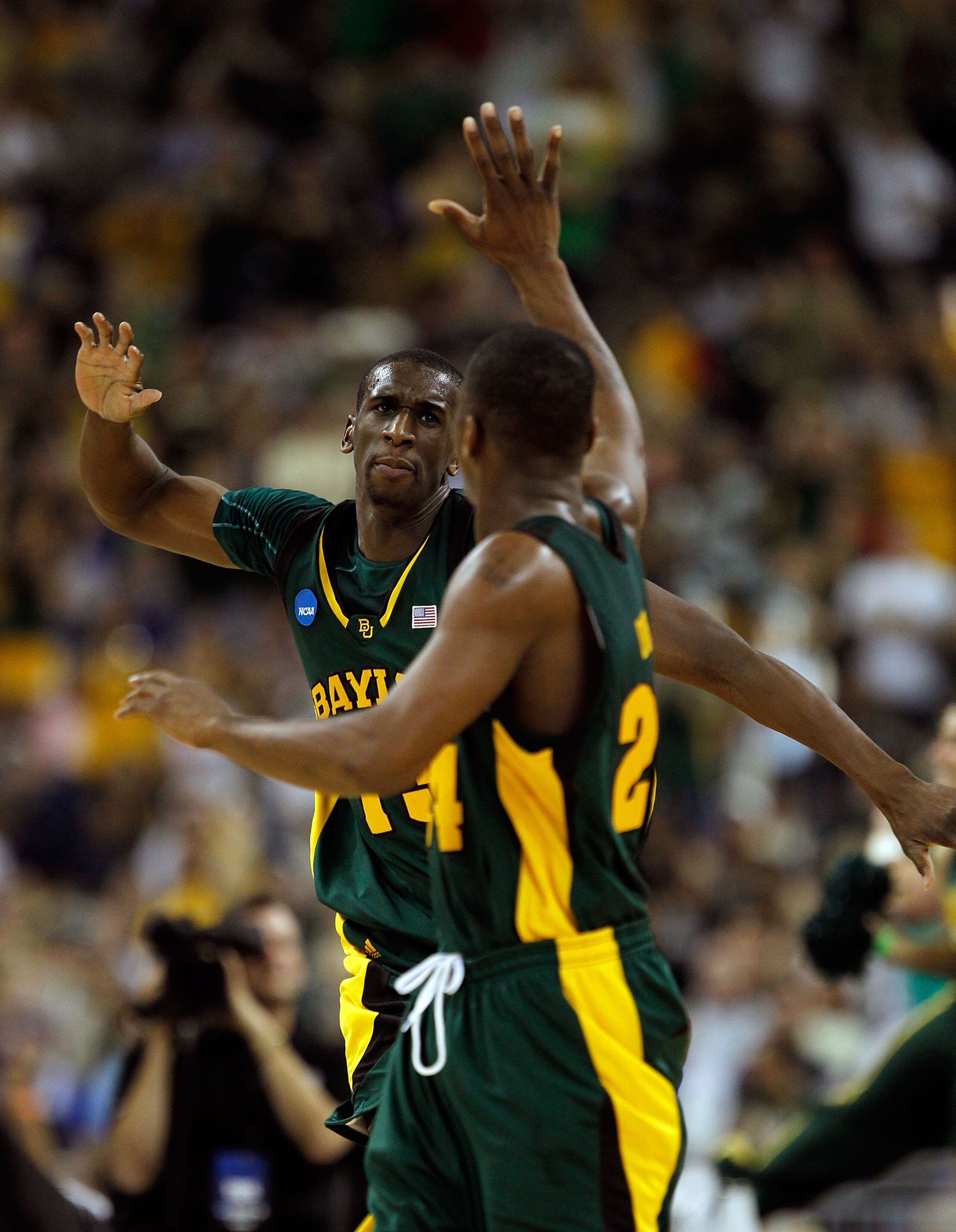 HOUSTON - MARCH 28: Ekpe Udoh #13 of the Baylor Bears celebrates a shot with teammate LaceDarius Dunn #24 against the Duke Blue Devils during the south regional final of the 2010 NCAA men's basketball tournament at Reliant Stadium on March 28, 2010 in Hou