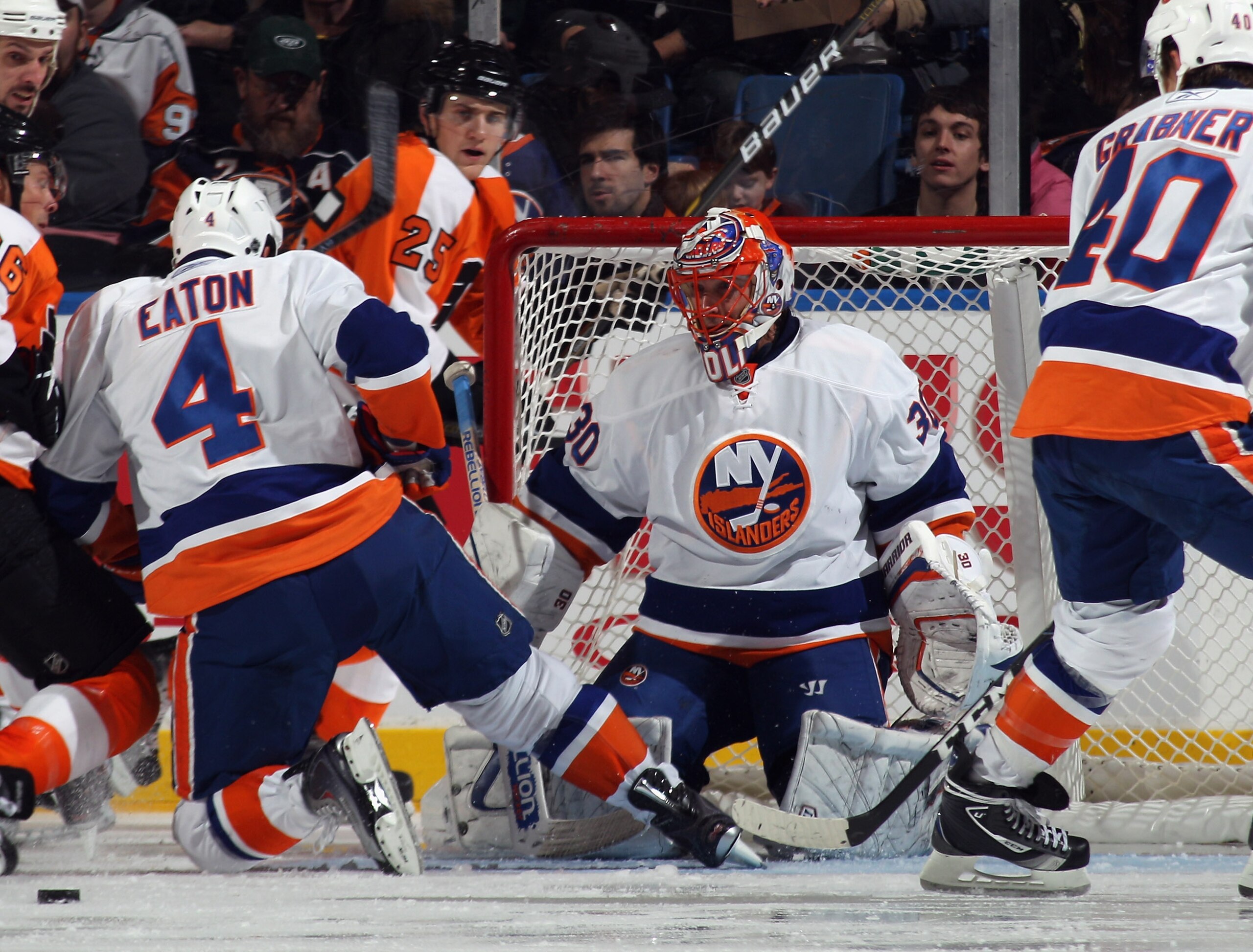 UNIONDALE, NY - DECEMBER 05:  Dwayne Roloson #30 of the New York Islanders tends net against the Philadelphia Flyers at the Nassau Coliseum on December 5, 2010 in Uniondale, New York.  (Photo by Bruce Bennett/Getty Images)