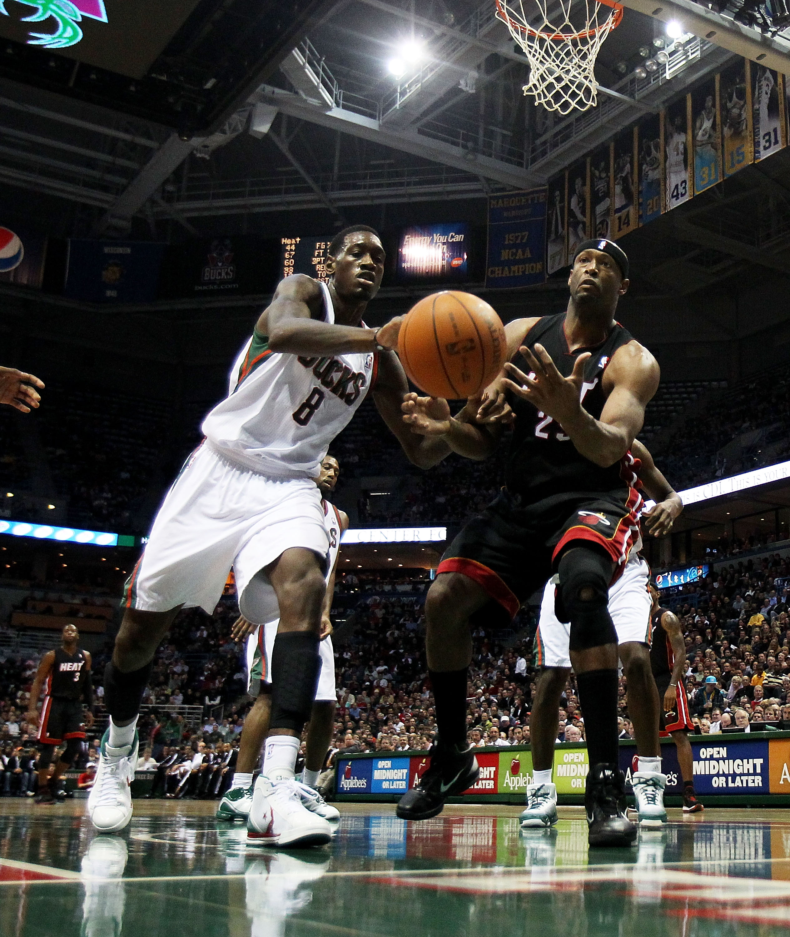 MILWAUKEE, WI - DECEMBER 06: Erick Dampier #25 of the Miami Heat and Larry Sanders #8 of the Milwaukee Bucks moves toward a loose ball at the Bradley Center on December 6, 2010 in Milwaukee, Wisconsin. The Heat defeated the Bucks 88-78. NOTE TO USER: User