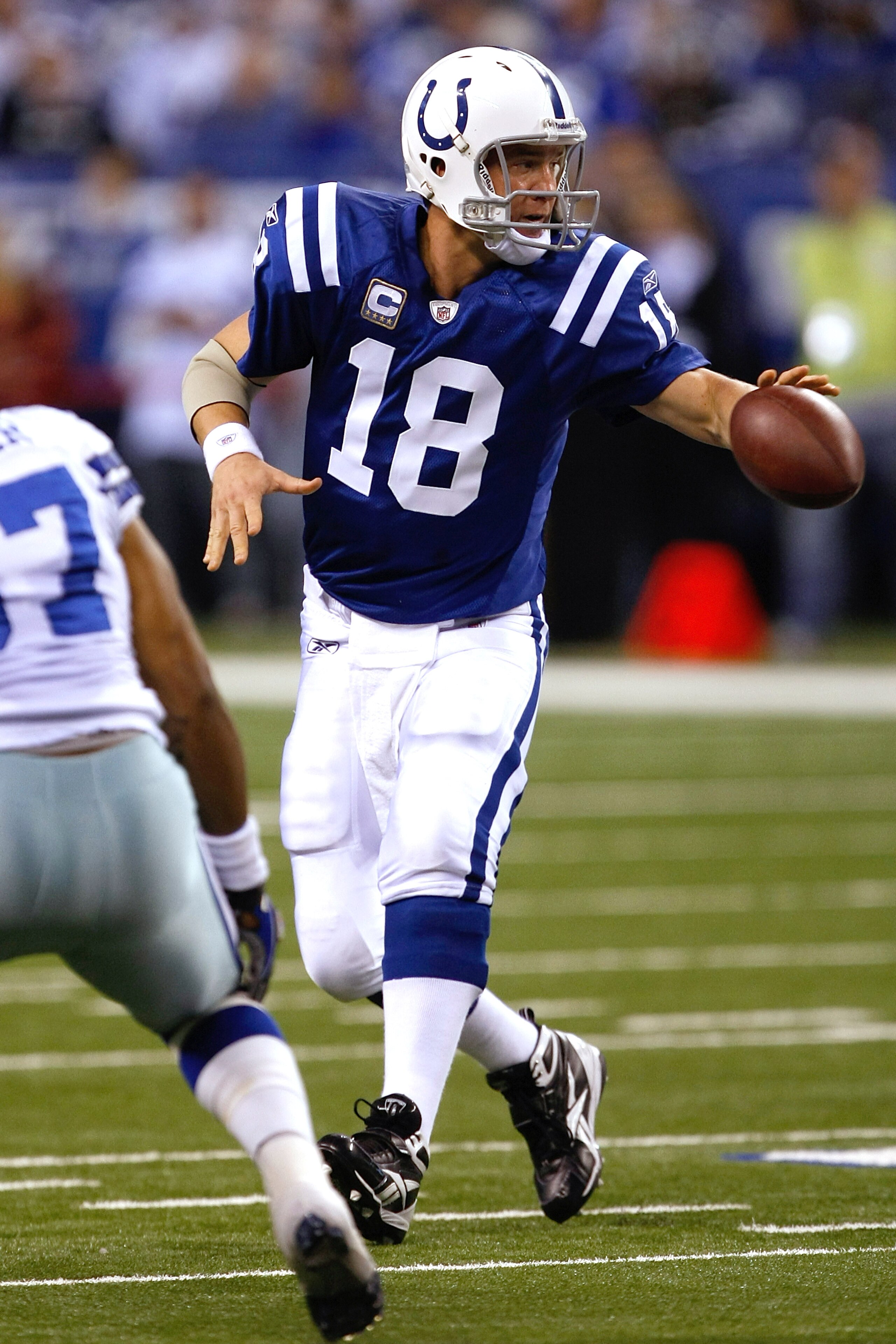 INDIANAPOLIS, IN - DECEMBER 05: Peyton Manning #18 of the Indianapolis Colts pitches the football against the Dallas Cowboys at Lucas Oil Stadium on December 5, 2010 in Indianapolis, Indiana. The Cowboys defeated the Colts 38-35 in overtime. (Photo by Sco INDIANAPOLIS, IN - DECEMBER 05: Peyton Manning #18 of the Indianapolis Colts pitches the football against the Dallas Cowboys at Lucas Oil Stadium on December 5, 2010 in Indianapolis, Indiana. The Cowboys defeated the Colts 38-35 in overtime. (Photo by Sco