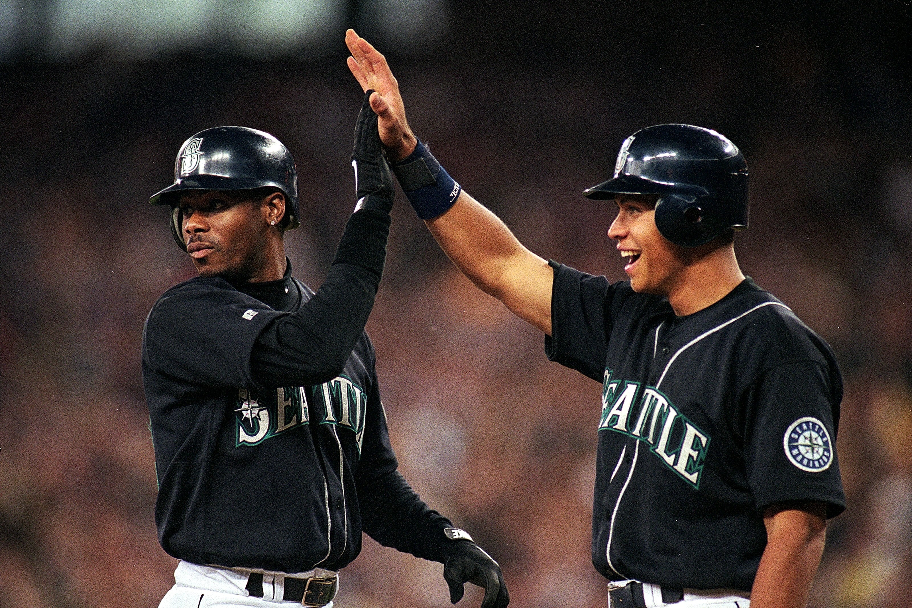 17 Jul 1999:  Ken Griffey Jr. #24 and Alex Rodriguez #3 of the Seattle Mariners hi-fiveing each other during the game against the San Diego Padres at Safeco Field in Seattle, Washington. The Mariners defeated the Padres 9-1. Mandatory Credit: Otto Greule