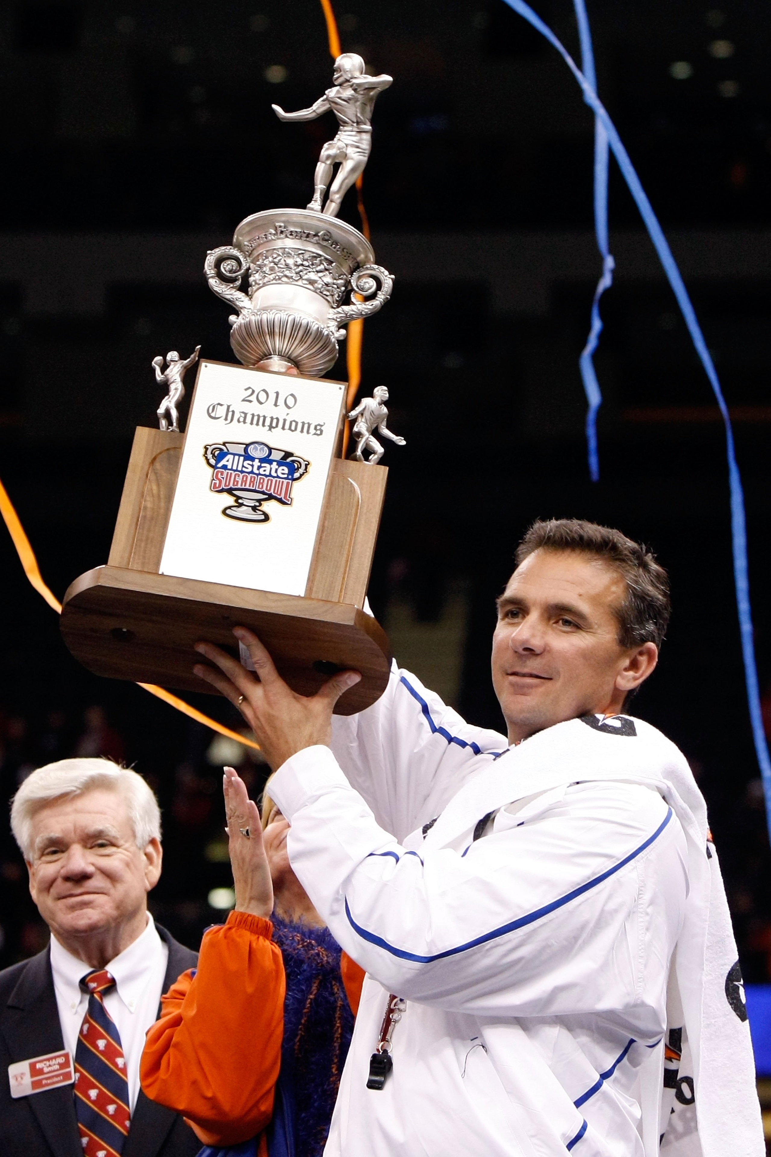 NEW ORLEANS - JANUARY 01:  Head coach Urban Meyer of the Florida Gators hoist the trophy after the Gators defeated the Cincinnati Bearcats 24-51 in the Allstate Sugar Bowl at the Louisana Superdome on January 1, 2010 in New Orleans, Louisiana.  (Photo by