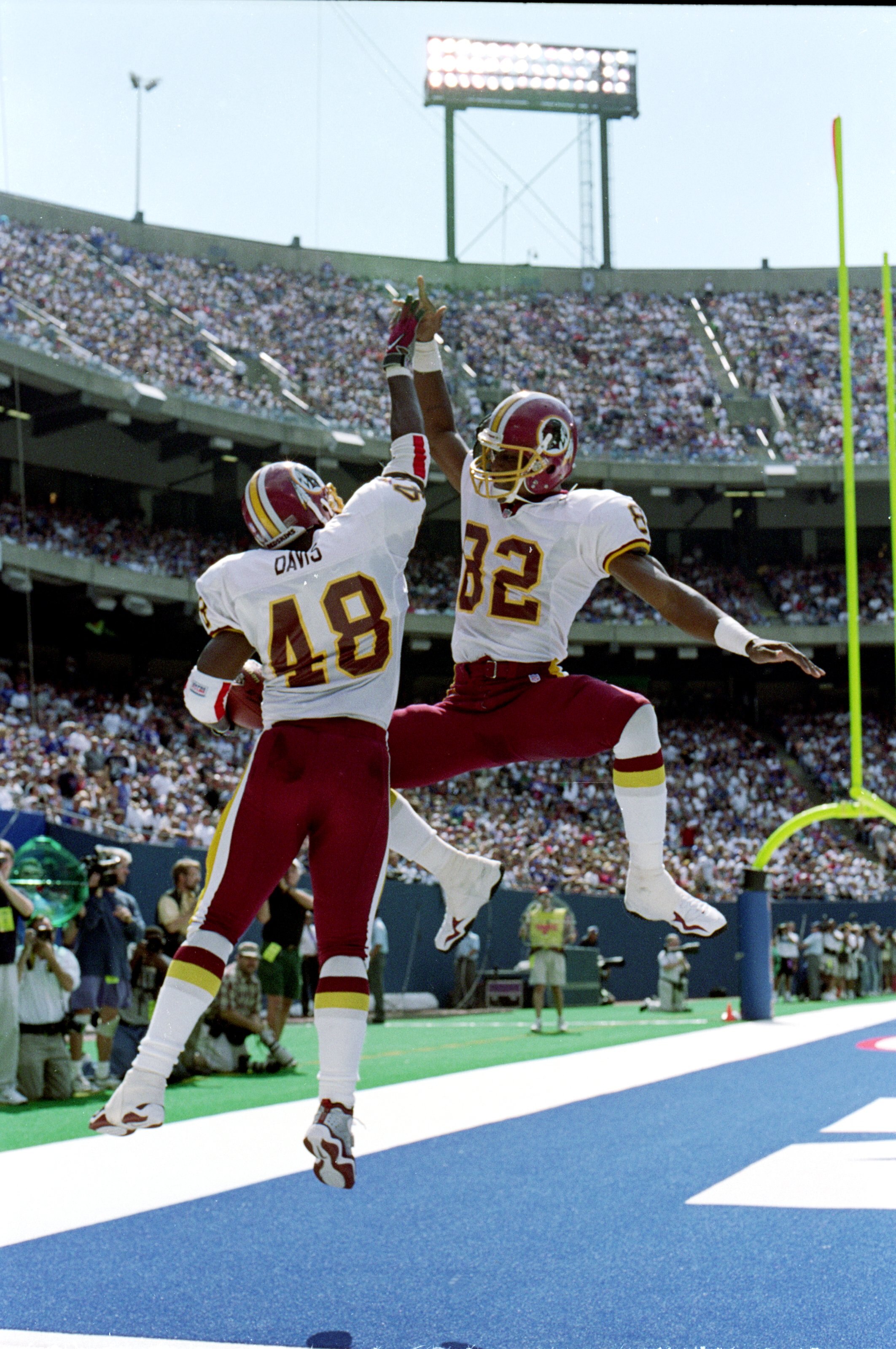 19 Sep 1999:  Stephen Davis #48 of the Washington Redskins celebrates with teammate Michael Westbrook #82 in the end zone during the game against the New York Giants at Giants Stadium in East Rutherford, New Jersey. The Redskins defeated the Giants 50-21.