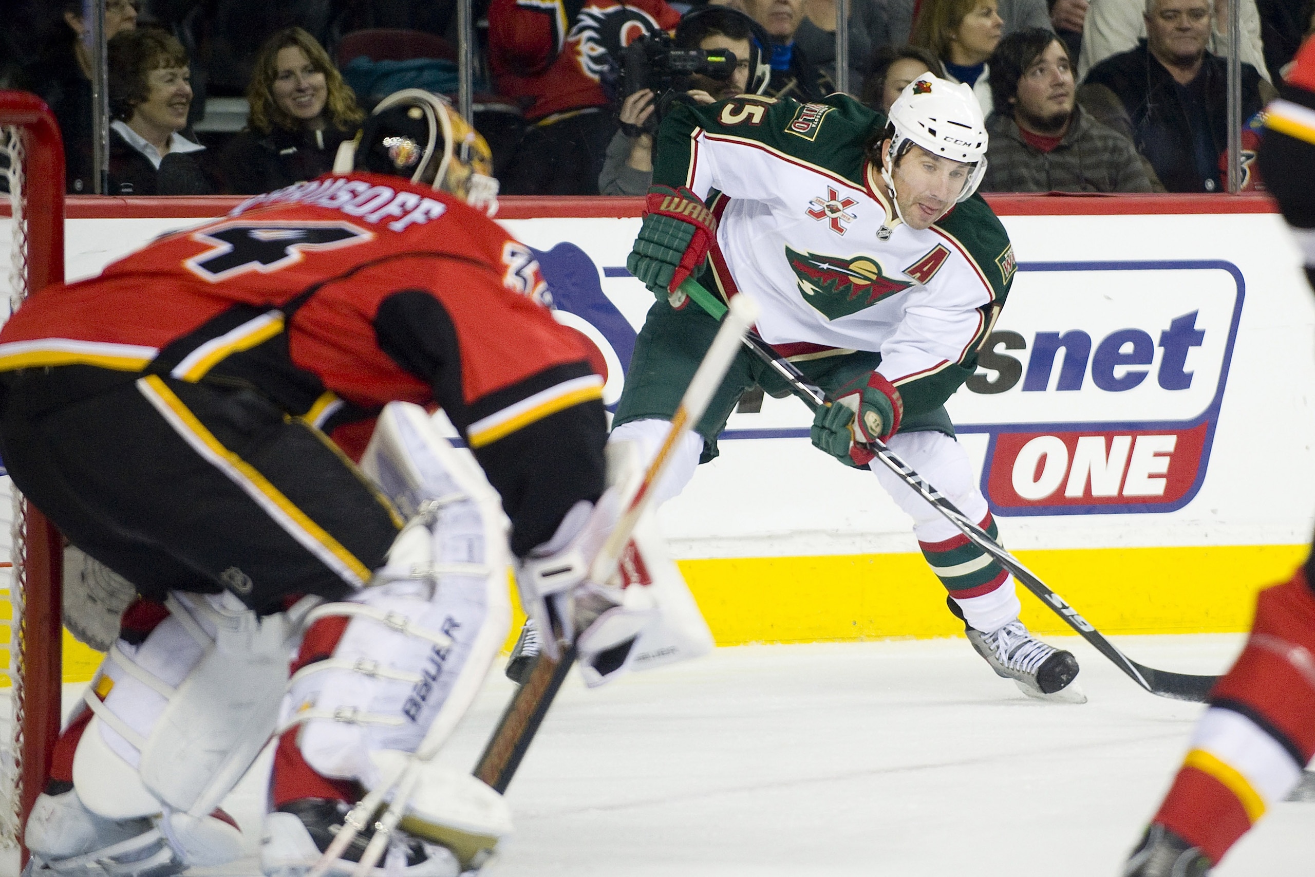 EDMONTON, AB - NOVEMBER 29:  Andrew Brunette #15 of the Minnesota Wild carries the puck in the corner against the Calgary Flames at Scotiabank Saddledome on November 29, 2010 in Calgary, Alberta, Canada. The Flames beat the Wild 3-0.  (Photo by Dylan Lync