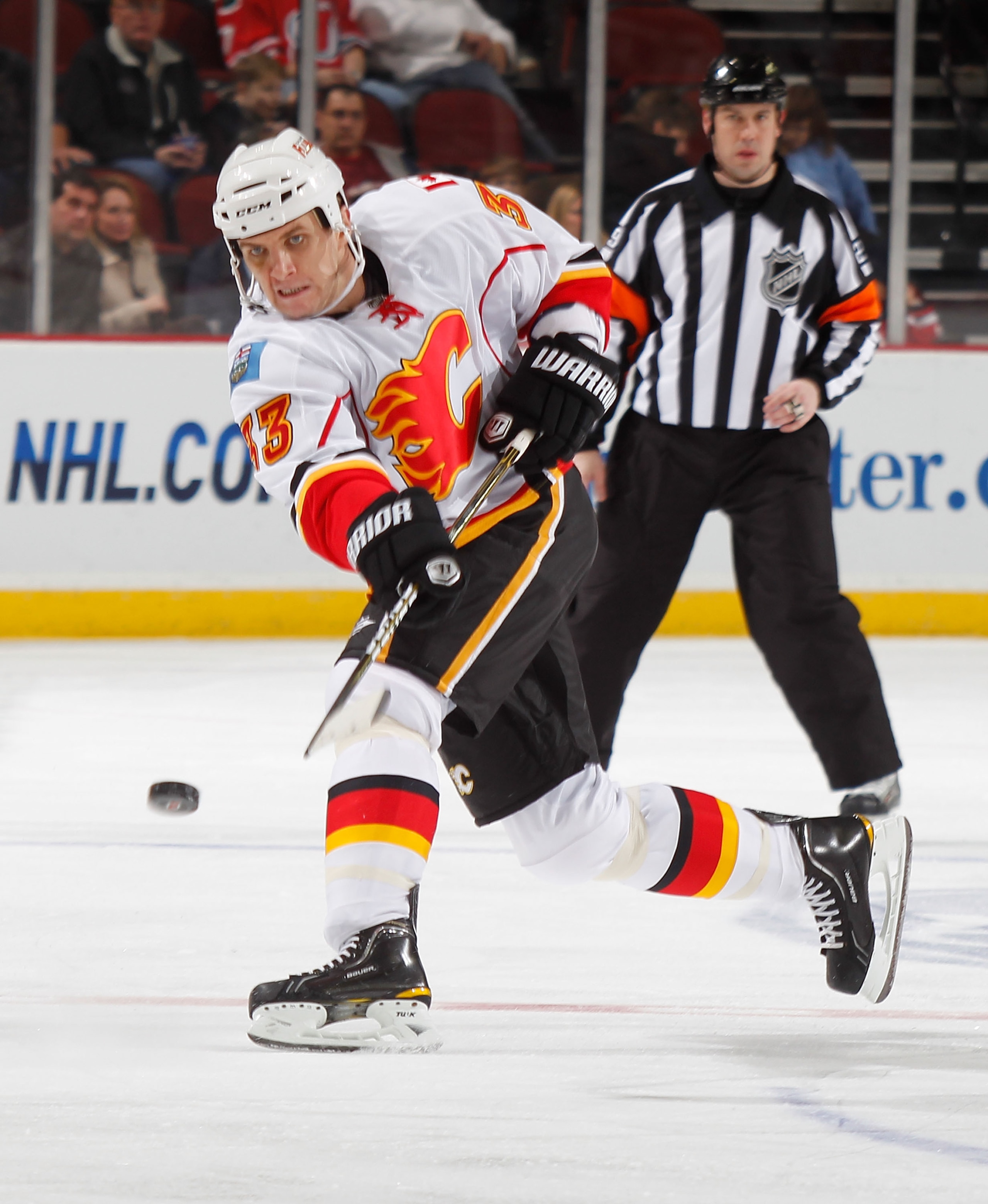 NEWARK, NJ - NOVEMBER 24:  Anton Babchuk #33 of the Calgary Flames shoots during a hockey game against the New Jersey Devils at the Prudential Center on November 24, 2010 in Newark, New Jersey.  (Photo by Paul Bereswill/Getty Images)