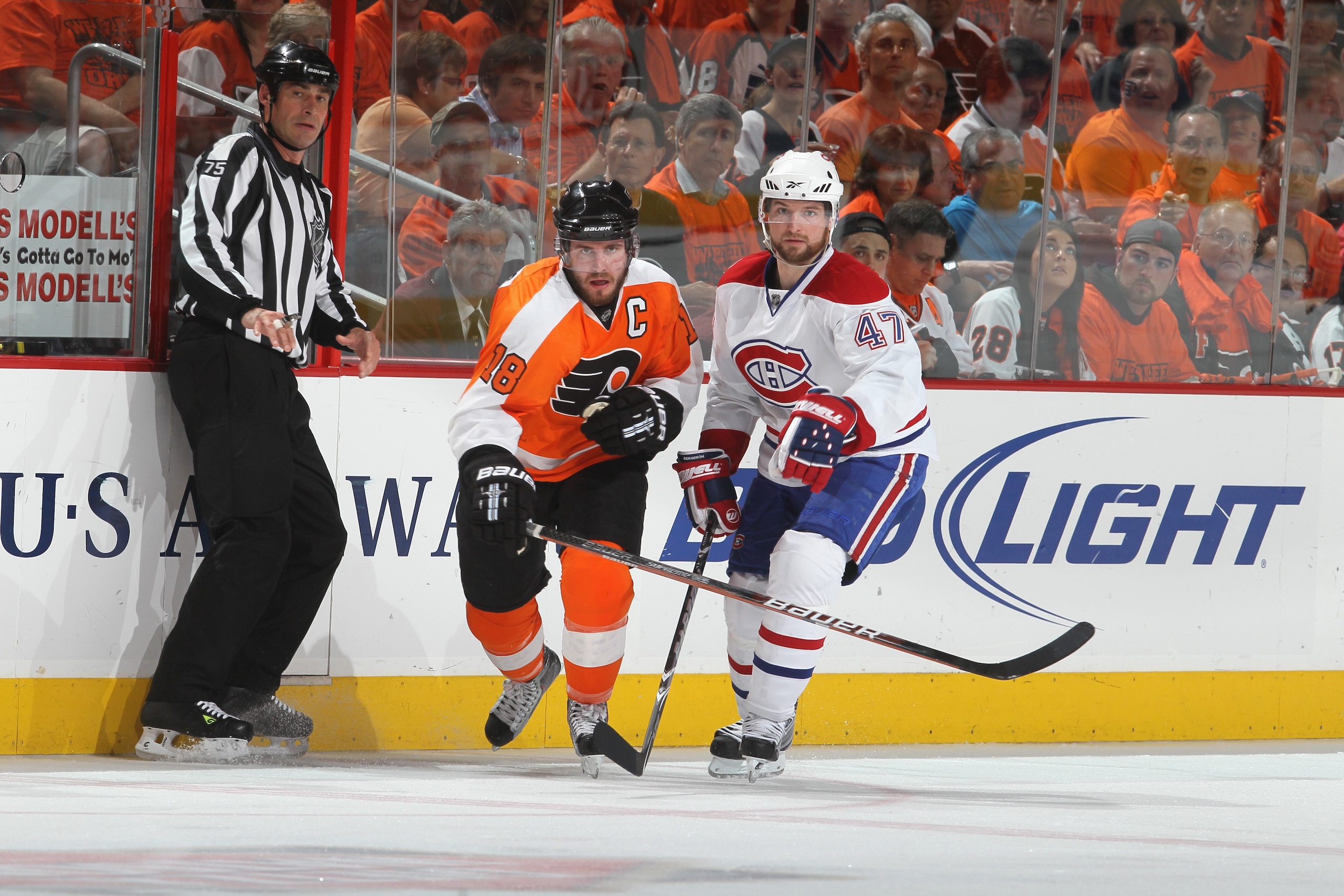 PHILADELPHIA - MAY 24:  Marc-Andre Bergeron #47 of the Montreal Canadiens skates for the puck against Mike Richards #18 of the Philadelphia Flyers in Game 5 of the Eastern Conference Finals during the 2010 NHL Stanley Cup Playoffs at Wachovia Center on Ma
