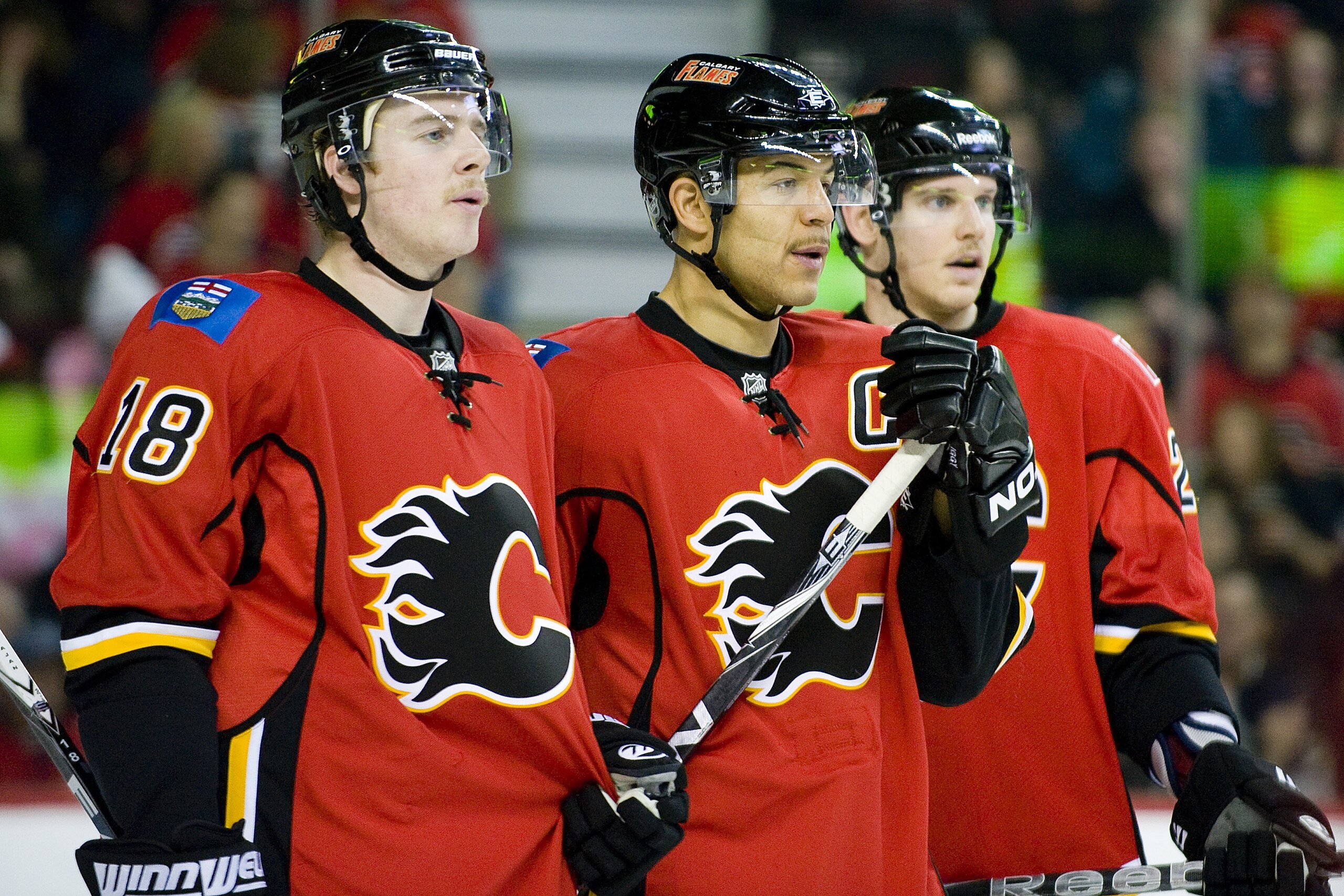EDMONTON, AB - NOVEMBER 29:  (L-R) Matt Stajan #18, Jarome Iginla and Brendan Mikkelson #29 of the Calgary Flames rest during a stoppage of play against the Minnesota Wild at Scotiabank Saddledome on November 29, 2010 in Calgary, Alberta, Canada. The Flam