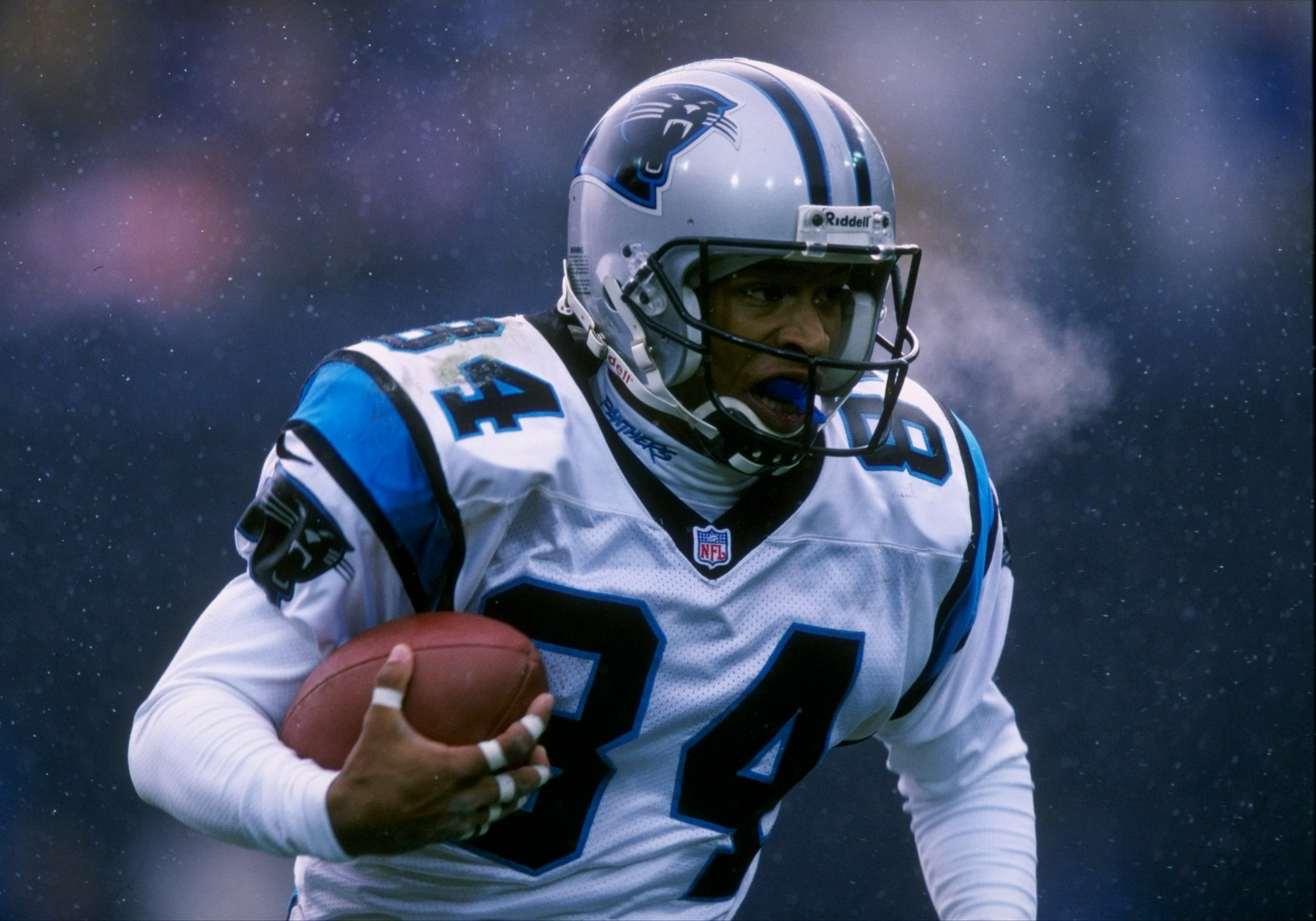 9 Nov 1997:  Wide receiver Rae Carruth of the Carolina Panthers moves the ball during a game against the Denver Broncos at Mile High Stadium in Denver, Colorado.  The Broncos won the game, 34-0. Mandatory Credit: Brian Bahr  /Allsport