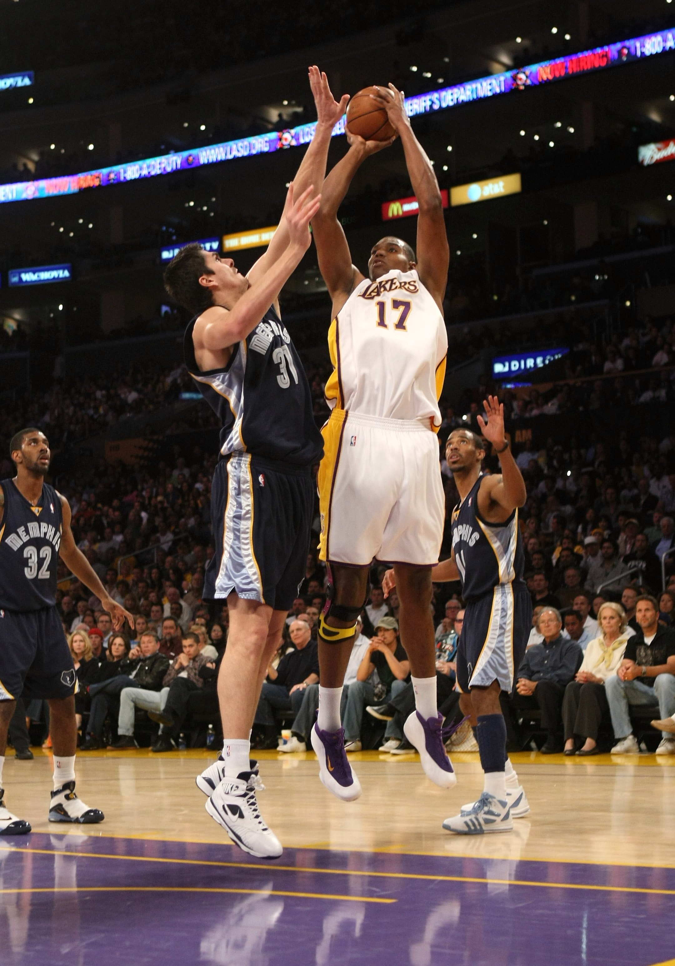 LOS ANGELES - APRIL 12:    Andrew Bynum #17 of the Los Angeles Lakers shoots over Darko Milicic #31 of the Memphis Grizzlies on April 12, 2009 at Staples Center in Los Angeles, California.   NOTE TO USER: User expressly acknowledges and agrees that, by do
