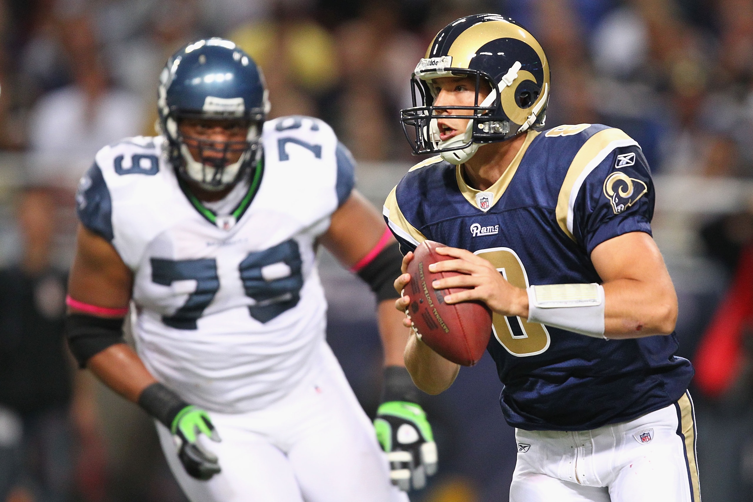 ST. LOUIS - OCTOBER 3: Sam Bradford #8 of the St. Louis Rams scrambles against the Seattle Seahawks at the Edward Jones Dome on October 3, 2010 in St. Louis, Missouri.  The Rams beat the Seahawks 20-3.  (Photo by Dilip Vishwanat/Getty Images)